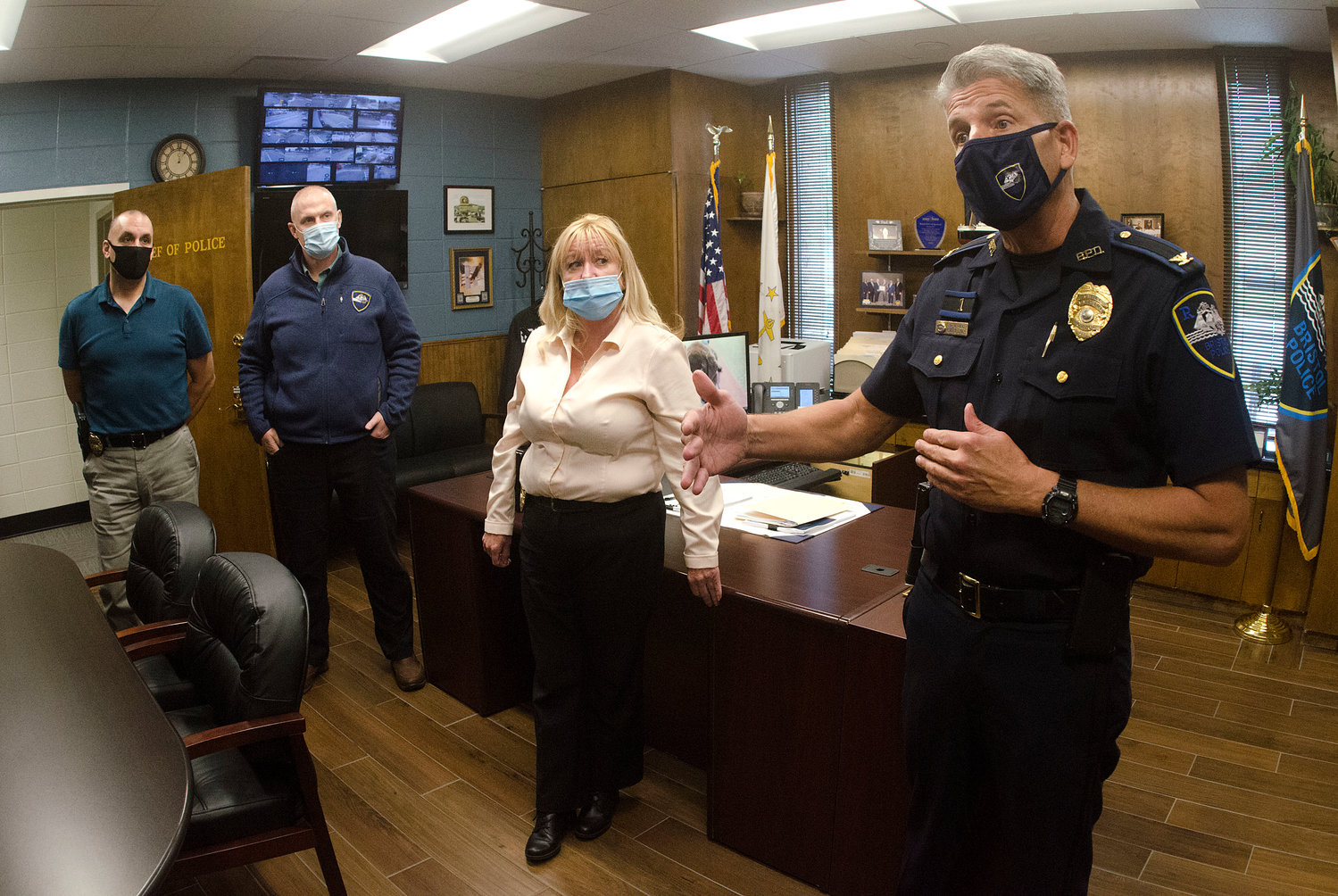Ptlm. George Lefebvre, Det. Adam Clifford, Det. Julie Veader and Chief Kevin Lynch (left to right) discuss the reallocation of staff resources to work on cold cases — a strategy to both keep officers fresh and engaged, and to fill downtime during the pandemic.