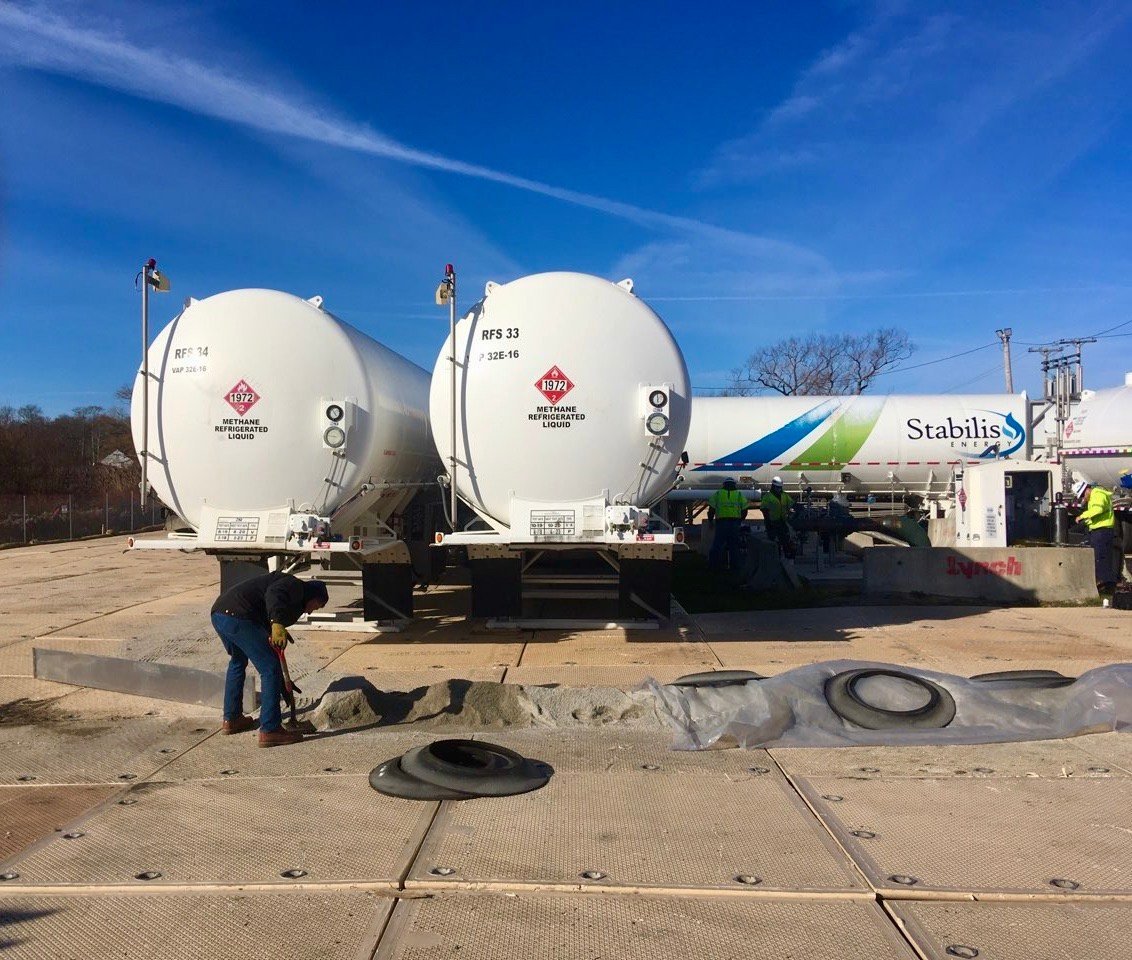 File photo of tanker trucks filled with liquefied natural gas at a temporary storage facility on Old Mill Lane, within a residential neighborhood.