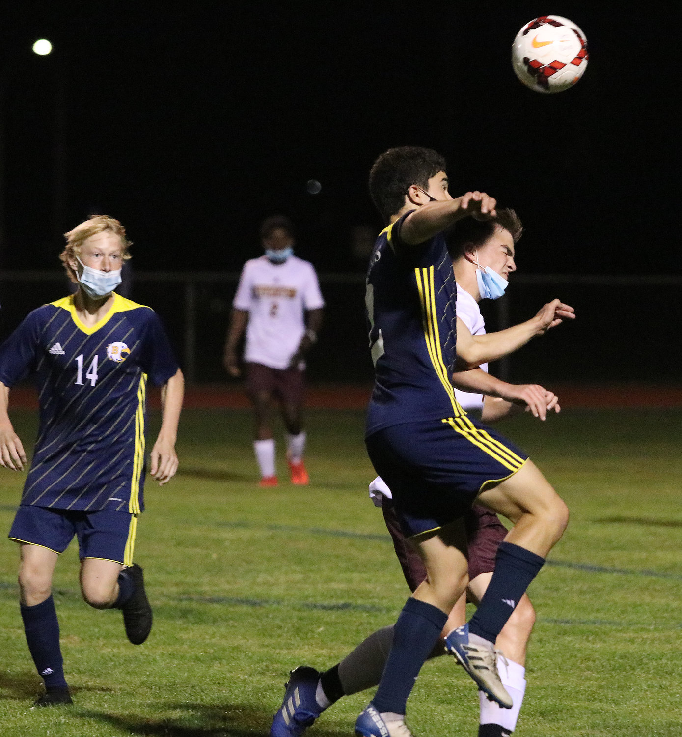 Barrington High School's Nico Arce elevates for a header while his teammate Leo Caldarella moves in, during the Eagles' game against Tiverton last week.