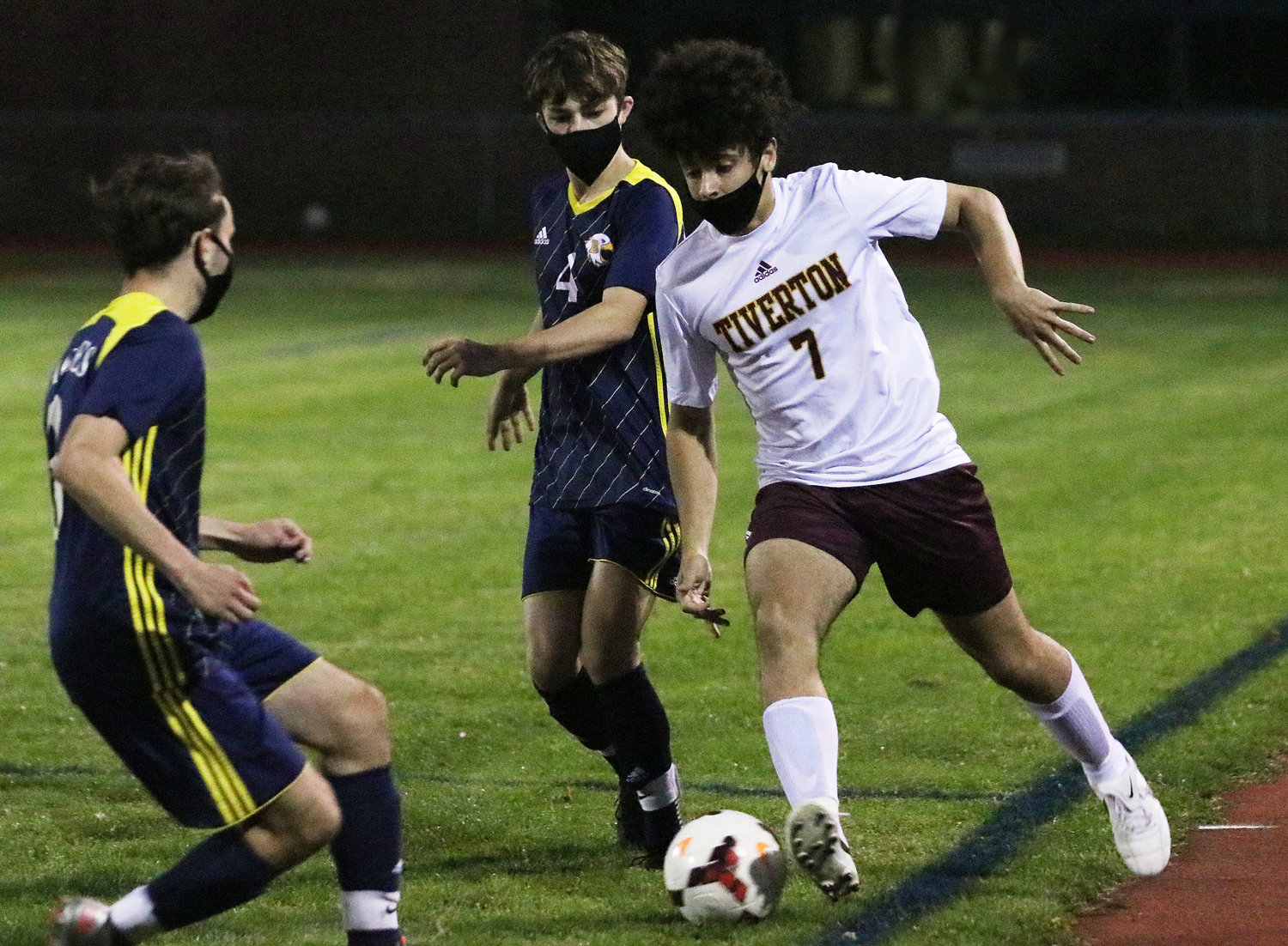 A pair of Barrington players look to contain a Tiverton player during the Eagles' 0-0 tie last week.