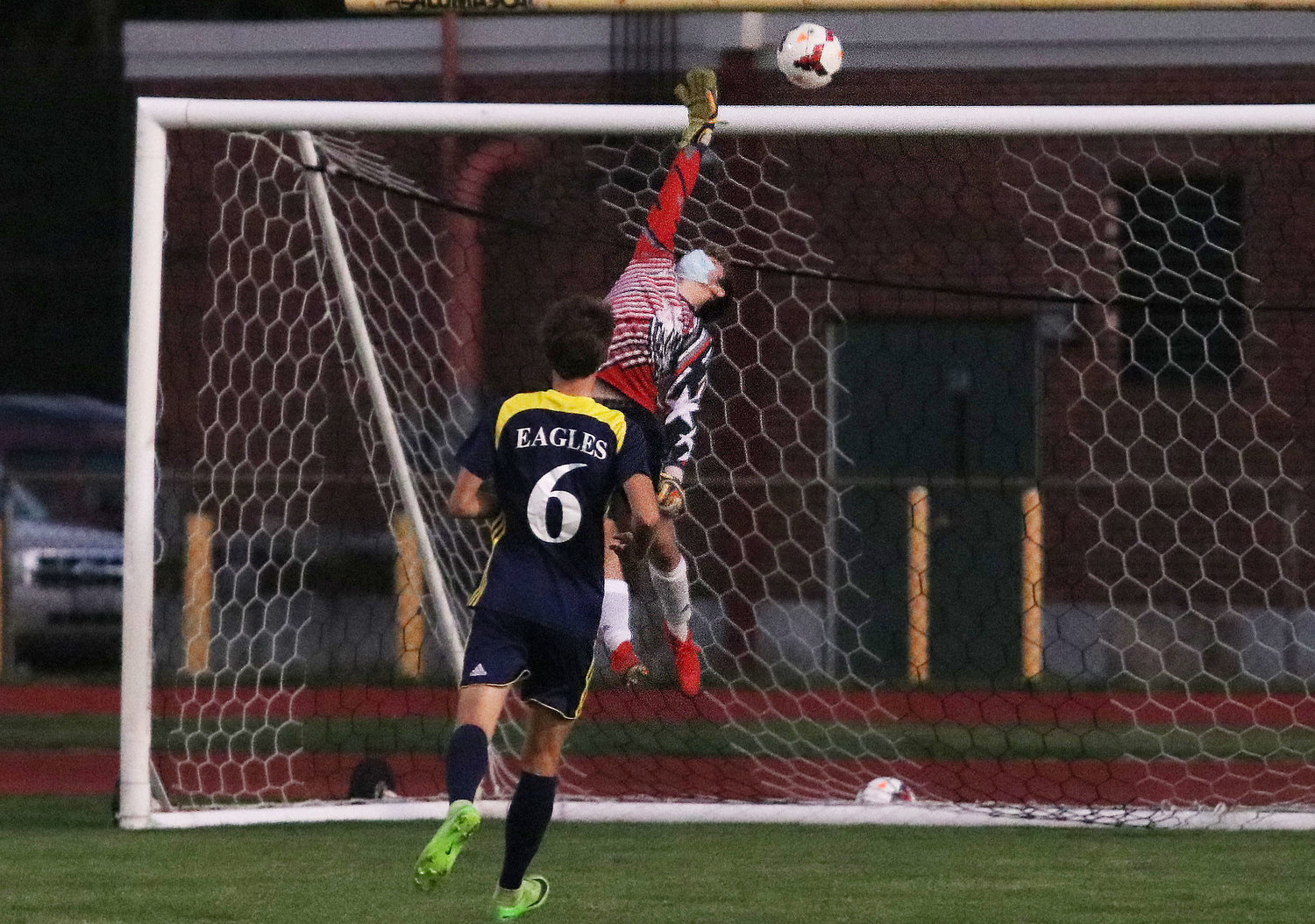 Barrington's Graham Vatter watches while a shot sails over the Tiverton goal.