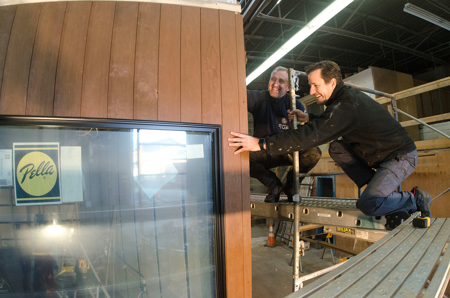 Andrew Naperotic (right) and Anders Hansen work on one of the ADDASPACE living/working units inside their Bristol facility.