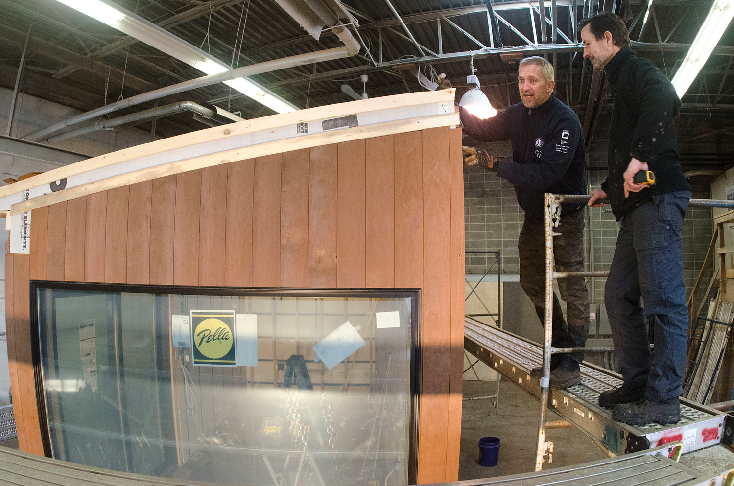 Andrew Naperotic (right) and Anders Hansen work on one of the ADDASPACE living/working units inside their Bristol facility.