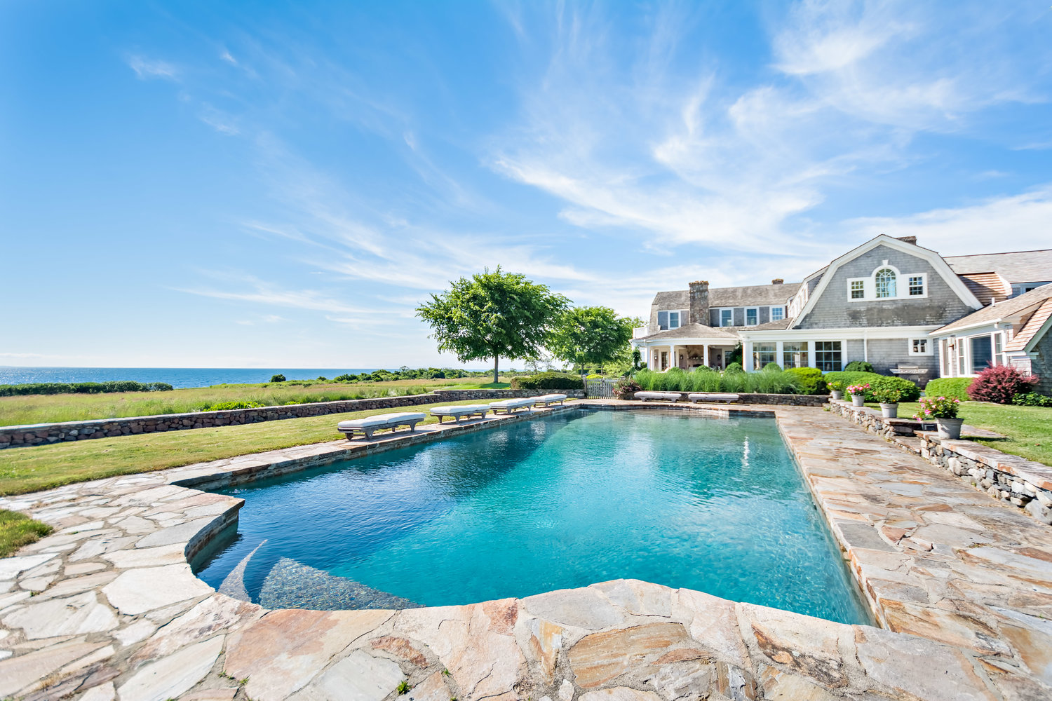 Sealands with its large pool and stone deck overlooking the ocean.