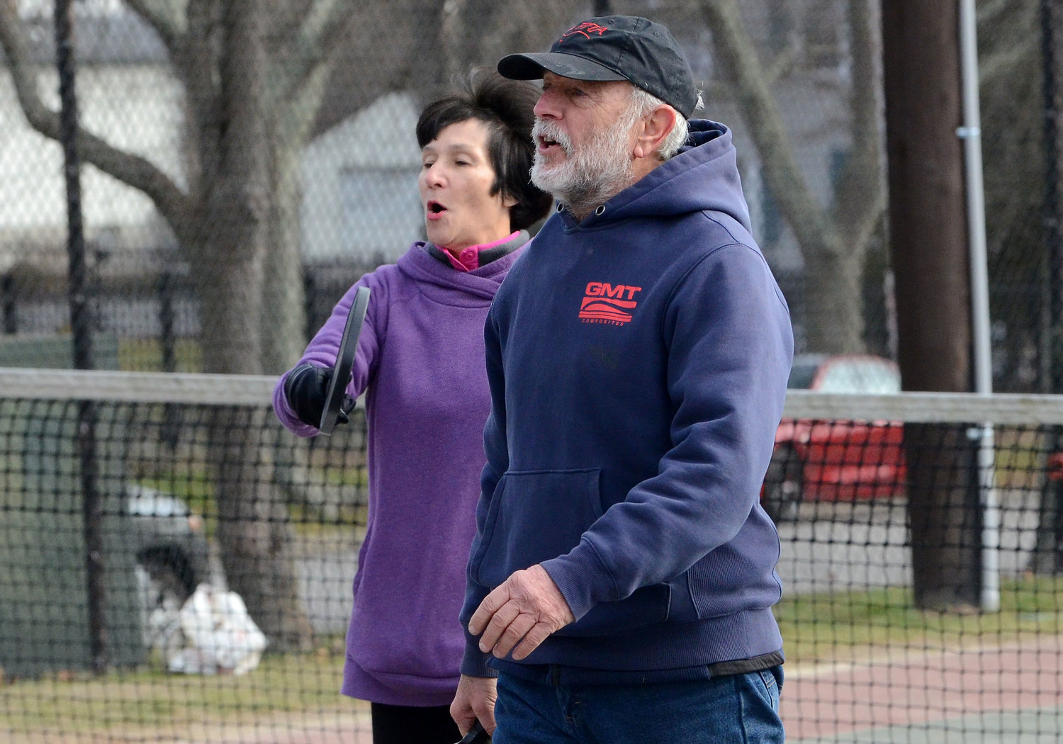 Teammates Eileen Malloy and Peter Maloney react after winning a point.