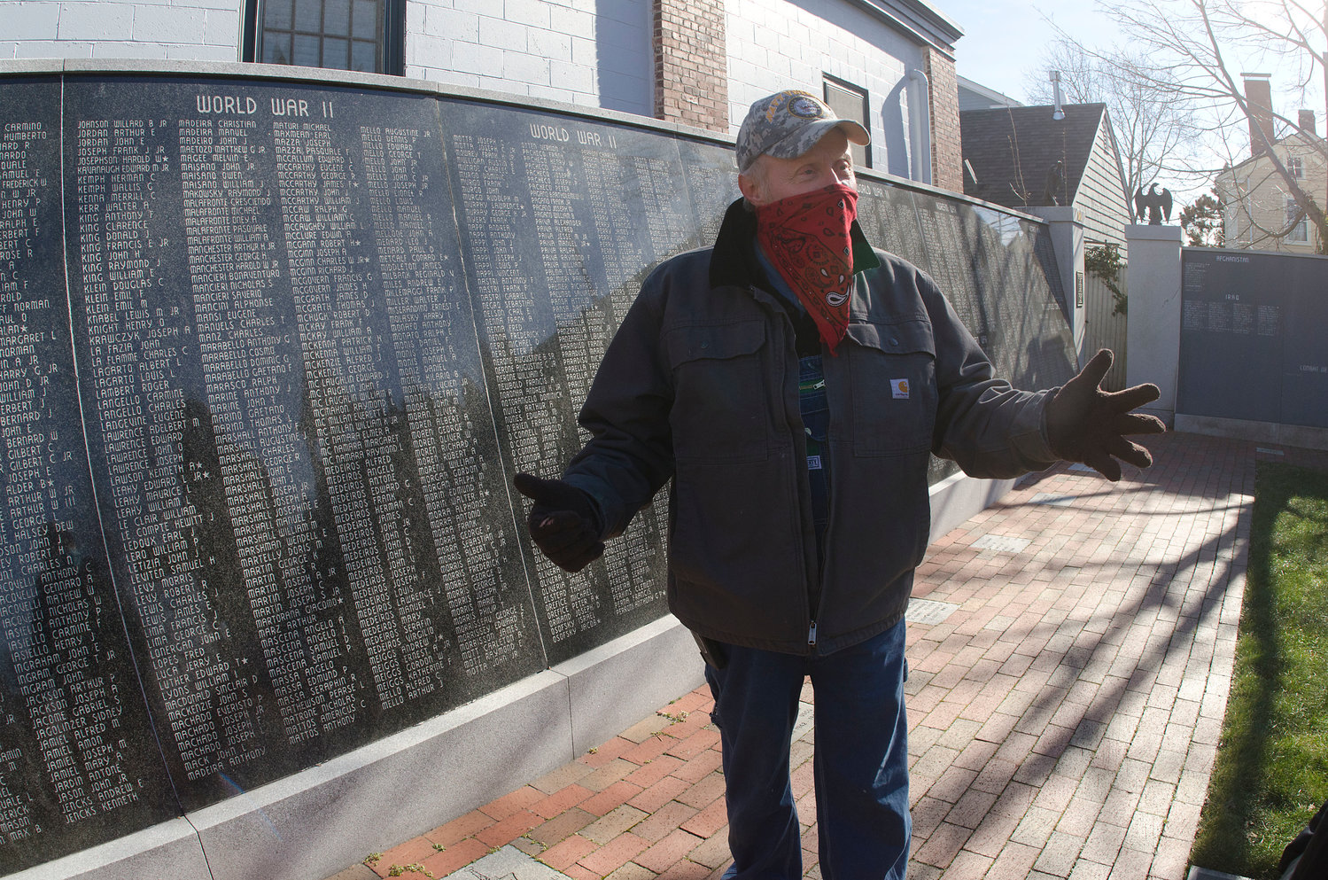 Veteran Karl Antonevich stands before the Memorial Garden, a place of reverence for Bristol veterans and citizens.