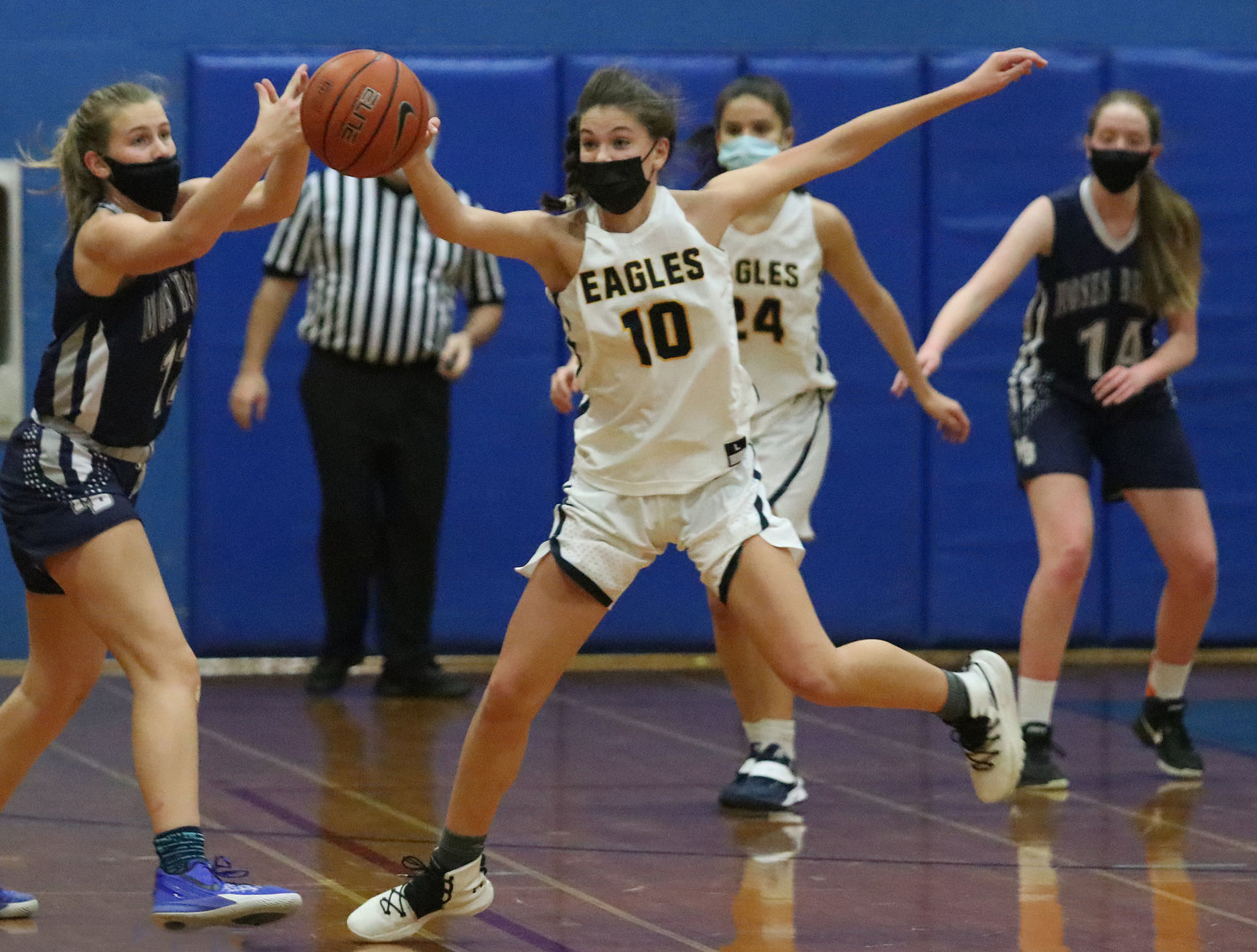 Barrington’s Dani Ceseretti steals a pass and makes her way toward the Moses Brown basket during the Eagles’ win last week.