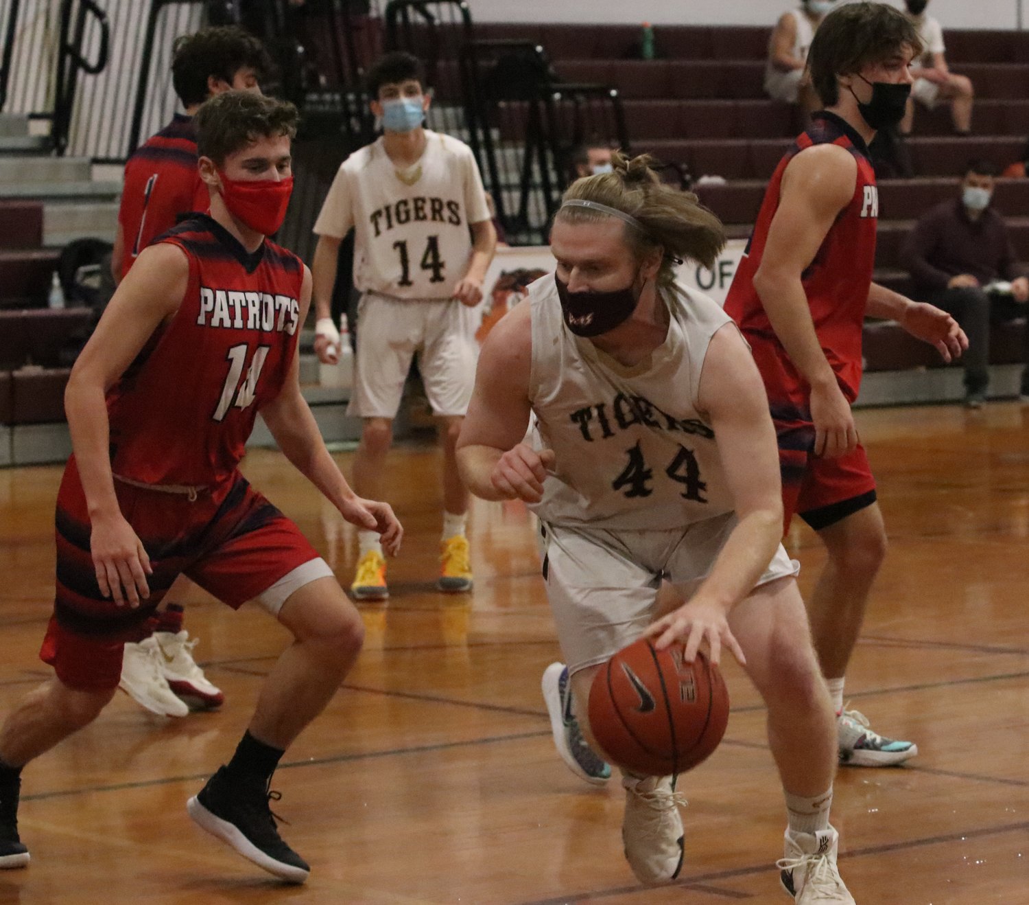 Senior Will Gerlach puts the ball on the floor and makes a move to the inside.
