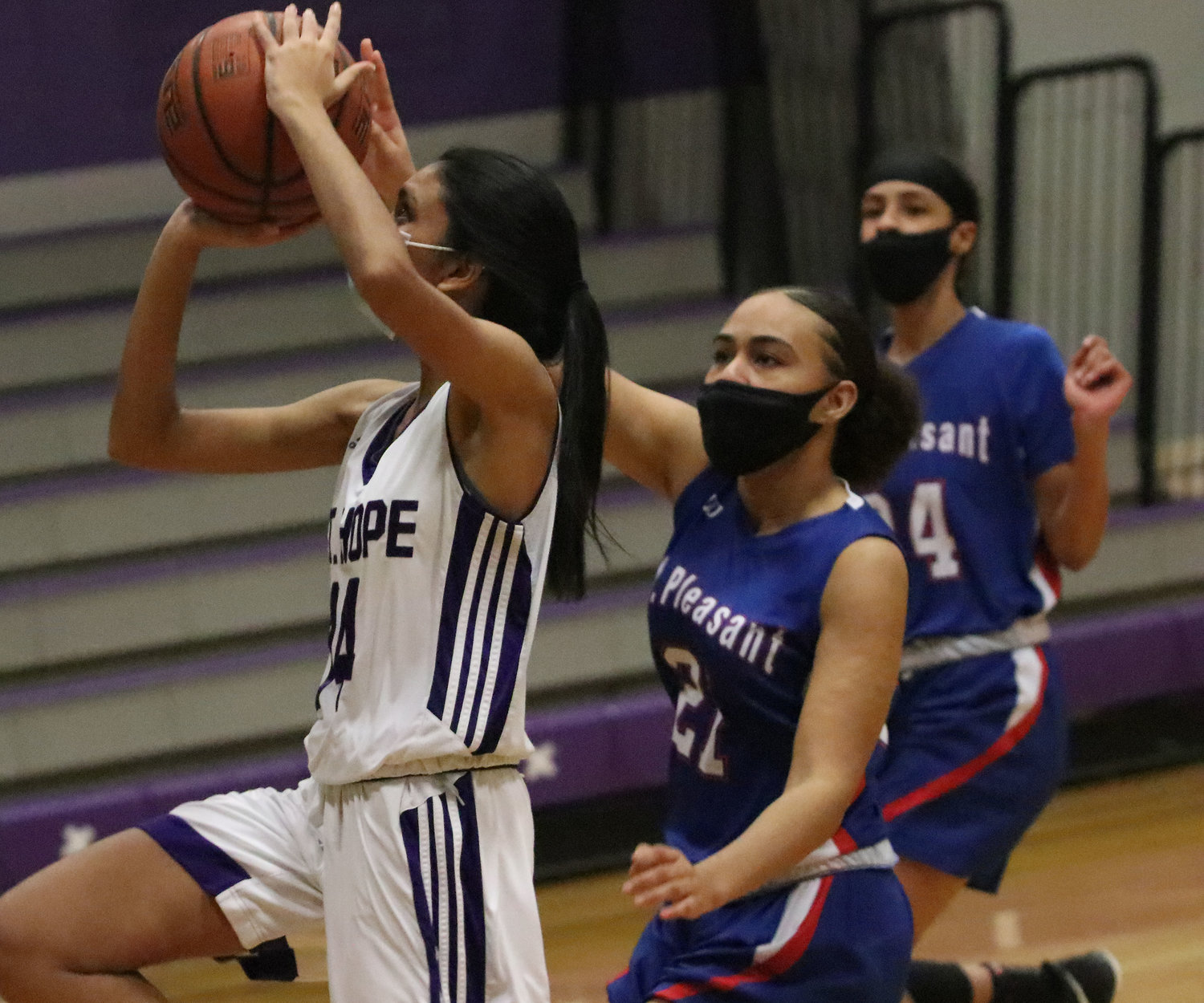 Point guard Junior Aditi Mehta drives in for a layup in the first half.