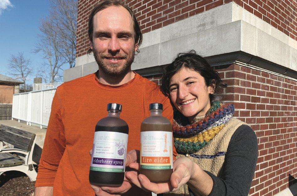 Adam Davenport (left) and Carissa Wills-DeMello show off some of their Town Farm Tonics products outside of Hope and Main.