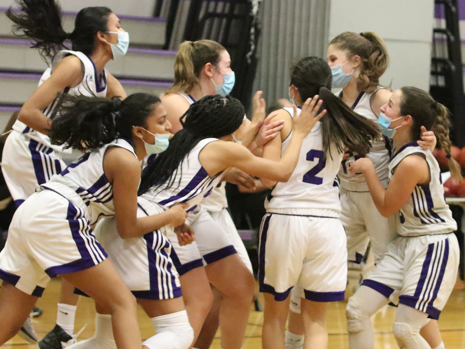 The Mt. Hope girls basketball team celebrates after defeating Woonsocket, 39-34 in the D-III semifinals on Wednesday night. The team will play in the championship game on Saturday.