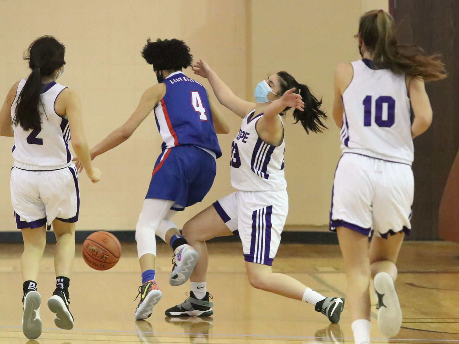 Sophomore guard Abby Razzino looks to score from under the basket. Razzino made six steals during the game according to stats accumulated by assistant coach James Brackett.
