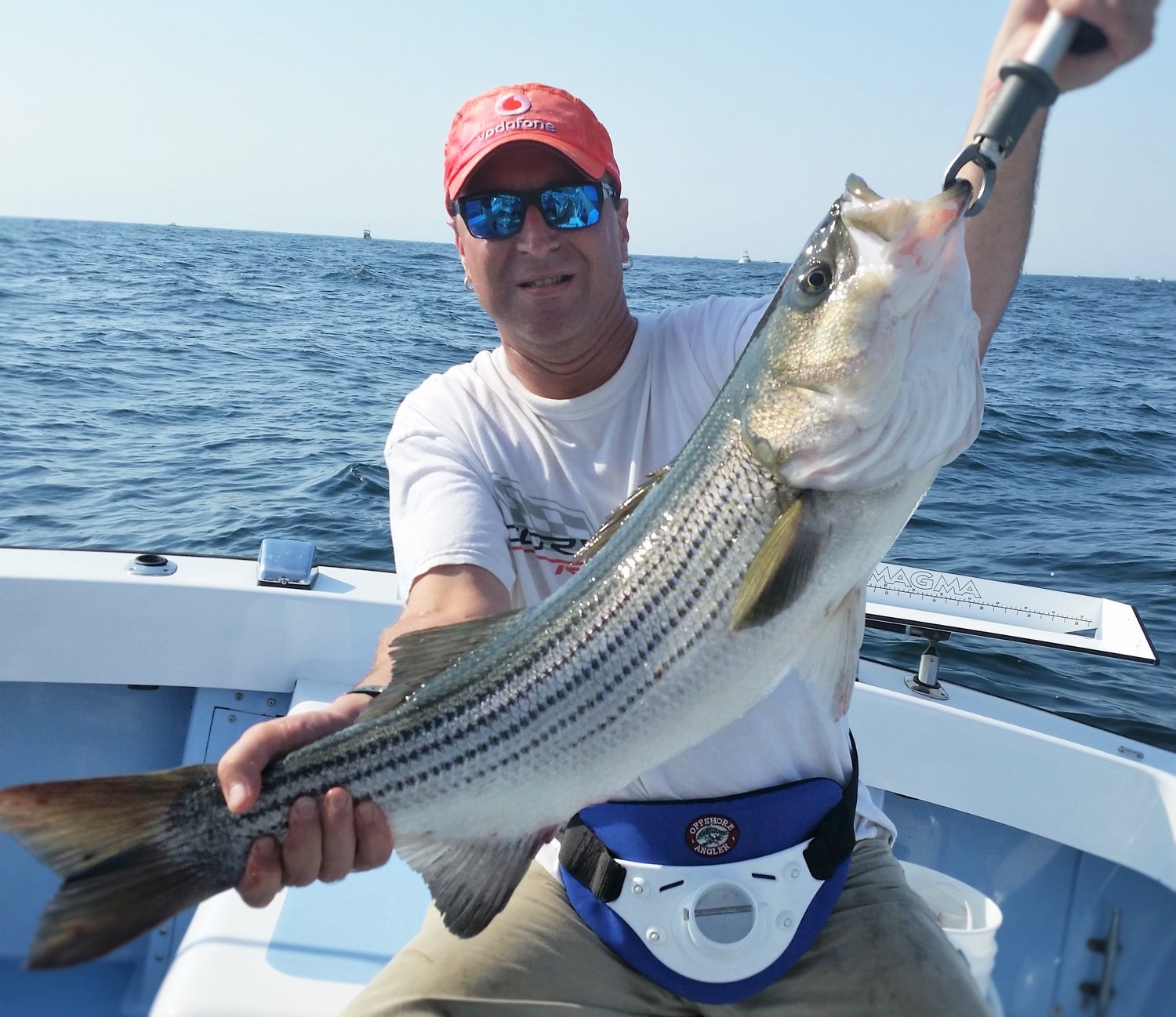 Striped bass Amendment:  Steve Burstein of West Warwick, RI with a Block Island striped bass.  Fish mangers are asking anglers for input on amendments for striped bass and four other species.