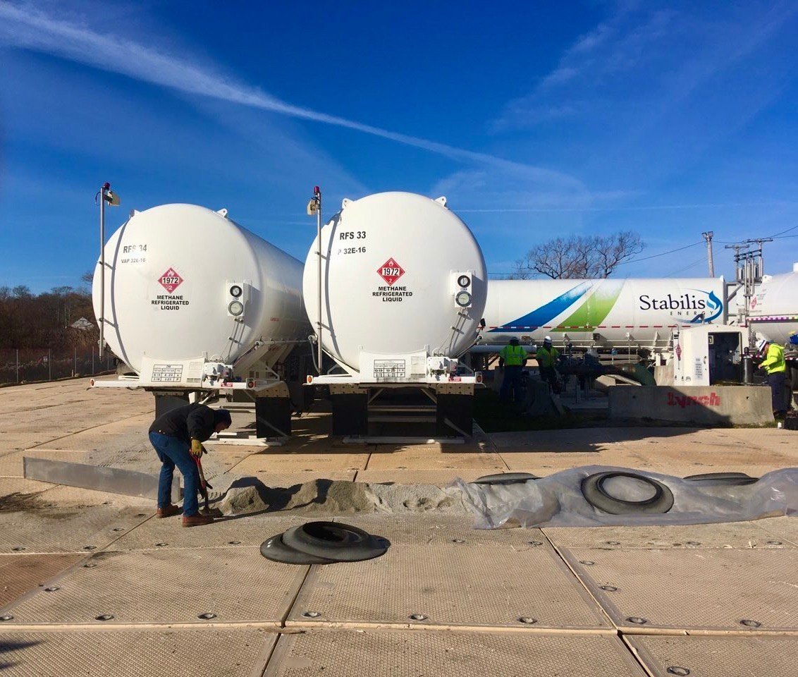 File photo of tanker trucks filled with liquefied natural gas at a temporary storage facility on Old Mill Lane, within a residential neighborhood. National Grid said it was planning to demobilize the seasonal facility on April 1. It may remain, however, for up to 10 more winters, according to the company.