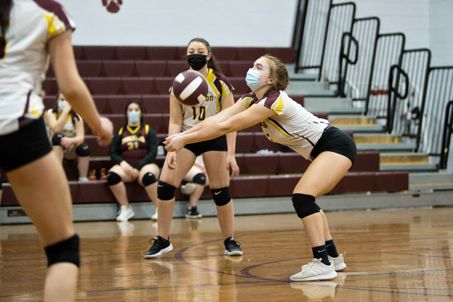Tiverton's Emily digs out a serve during Tuesday night's home match against Paul Cuffee School.