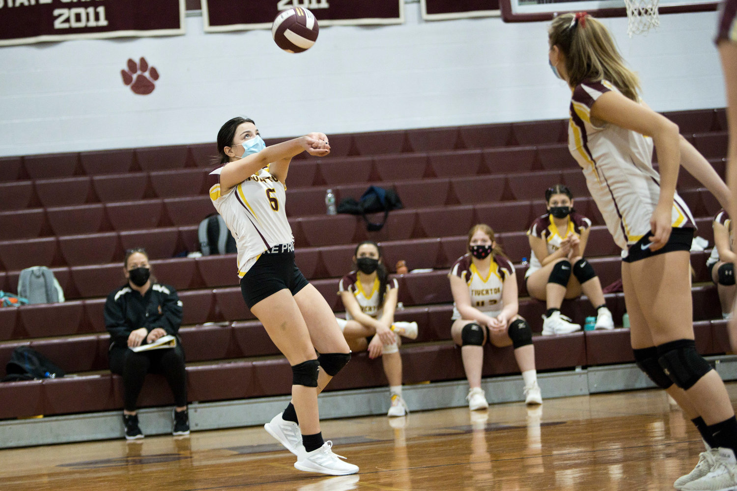 Gabby Piscani bumps the ball up for a teammate during Tuesday
night's game against Paul Cuffee School.