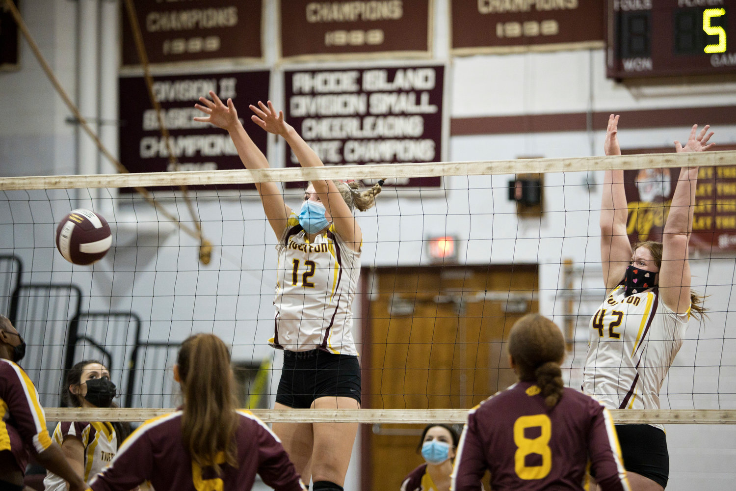 Molly Richardson and Madison Pelletier (right) block at the net during Friday night's game against Times Two Academy.