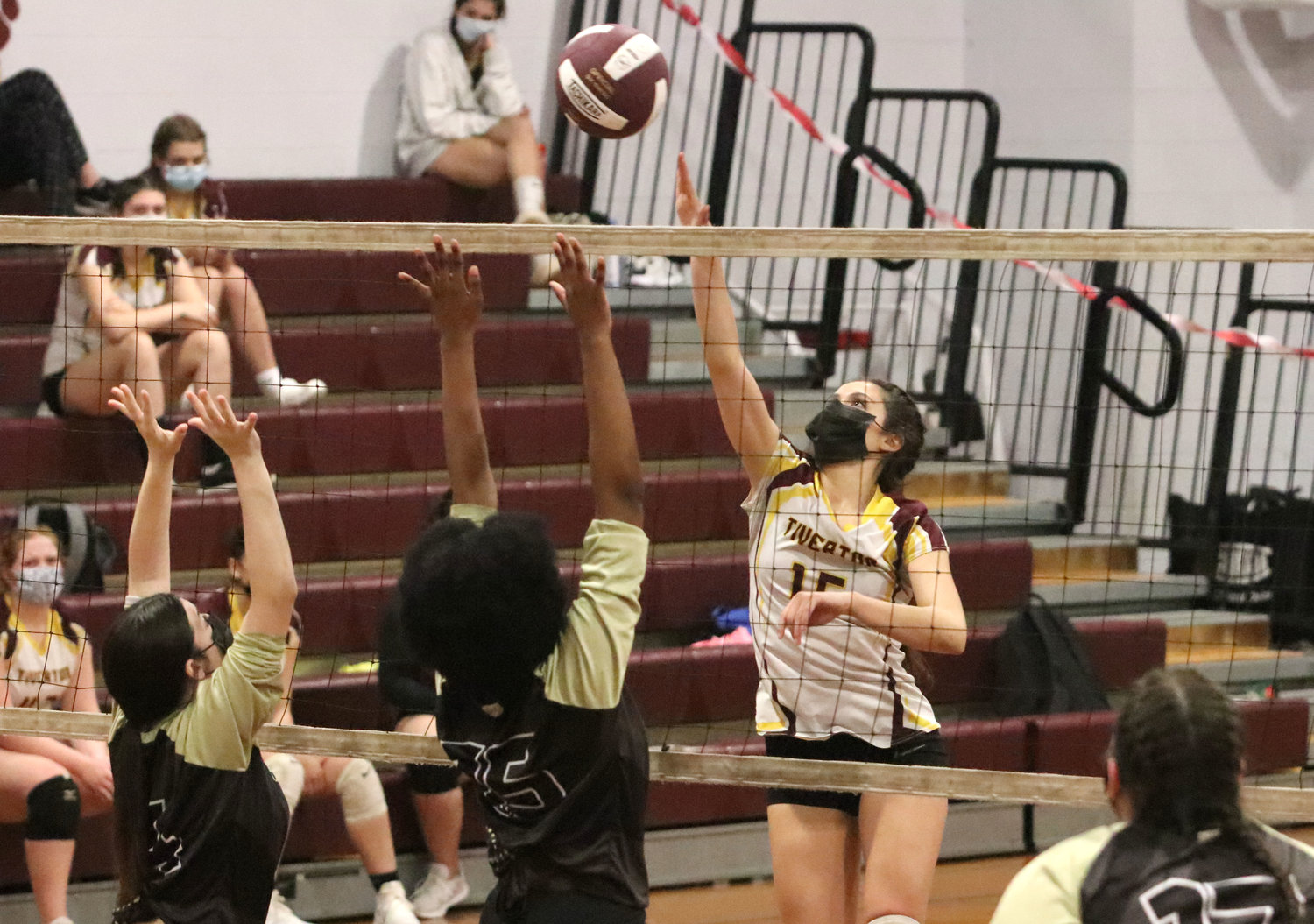 Kaylie Cabral hits the ball over the hands of the Davies blockers for a winner.