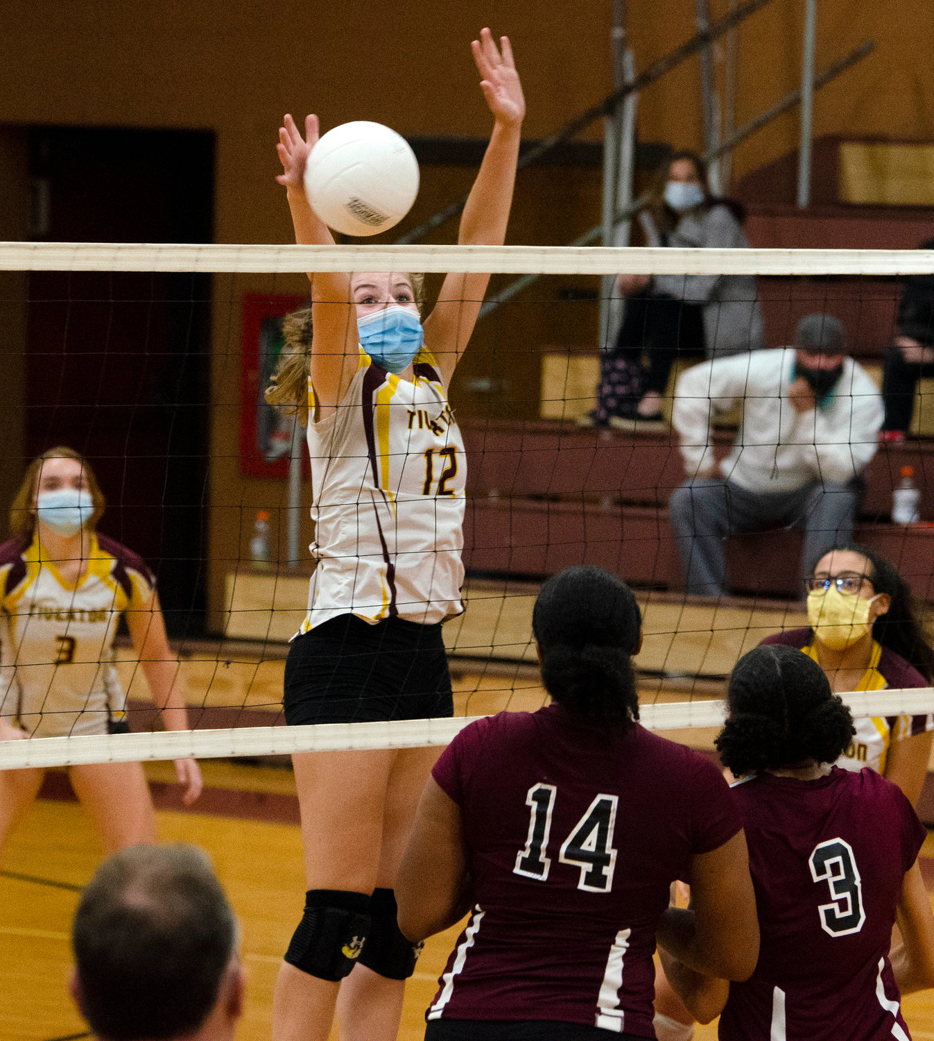 Tigers junior inside/outside hitter, Molly Richardson  smashes the ball over the net for a kill during the team's semifinals match against Woonsocket. 