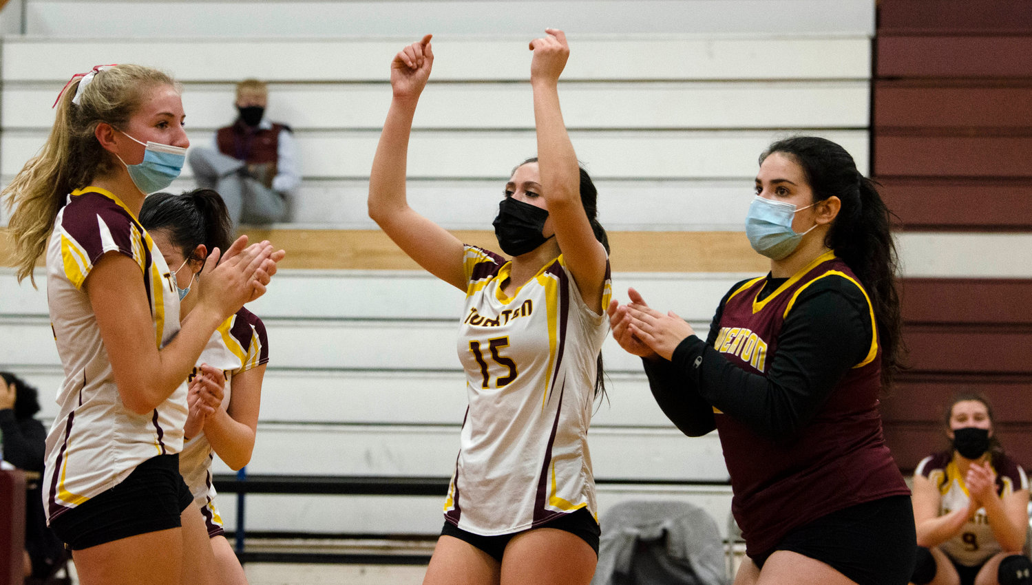 Molly Richardson (left), Gabby Piscani-Daugherty, Kaylie Cabral and Olivia DeMacedo celebrate after a Tigers point. 