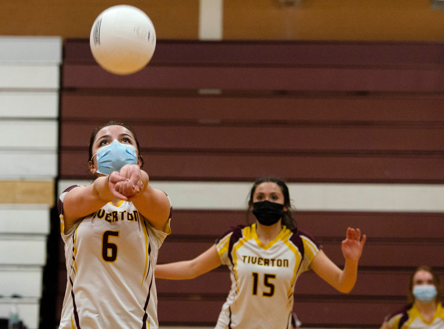 Gabby Piscani-Daugherty (left), sets the ball with teammate Kaylie Cabral looking on. 