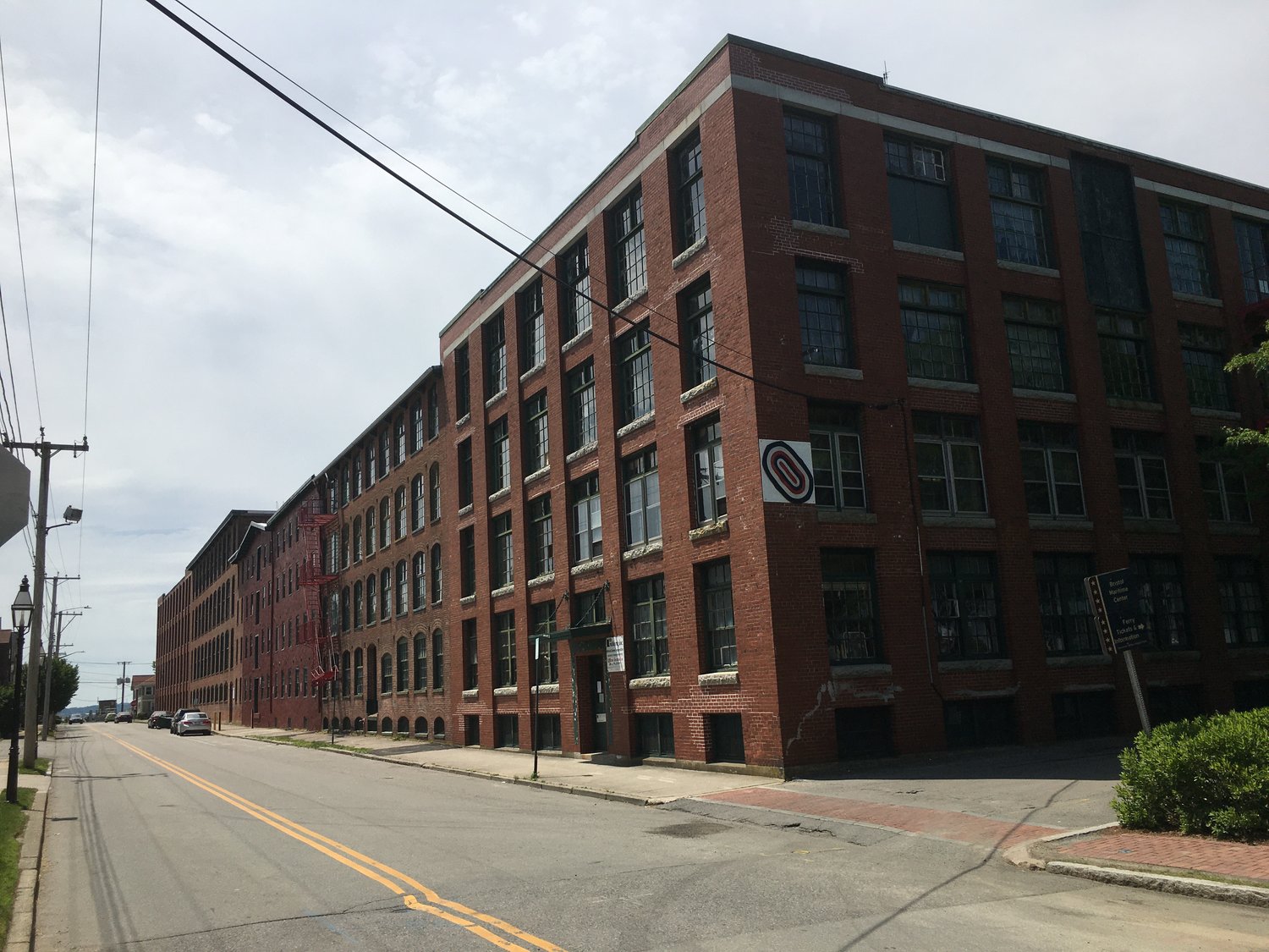 The Robin Rug mill complex at the south end of Thames Street has been the focus of redevelopment speculation for a few decades. A new proposal would create 151 apartments inside the complex.