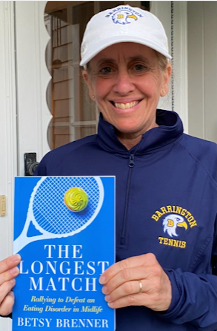 Longtime resident and BHS tennis coach Betsy Brenner displays a copy of her book "The Longest Match." She will read excerpts from the book at a special event at Barrington Books on Saturday.