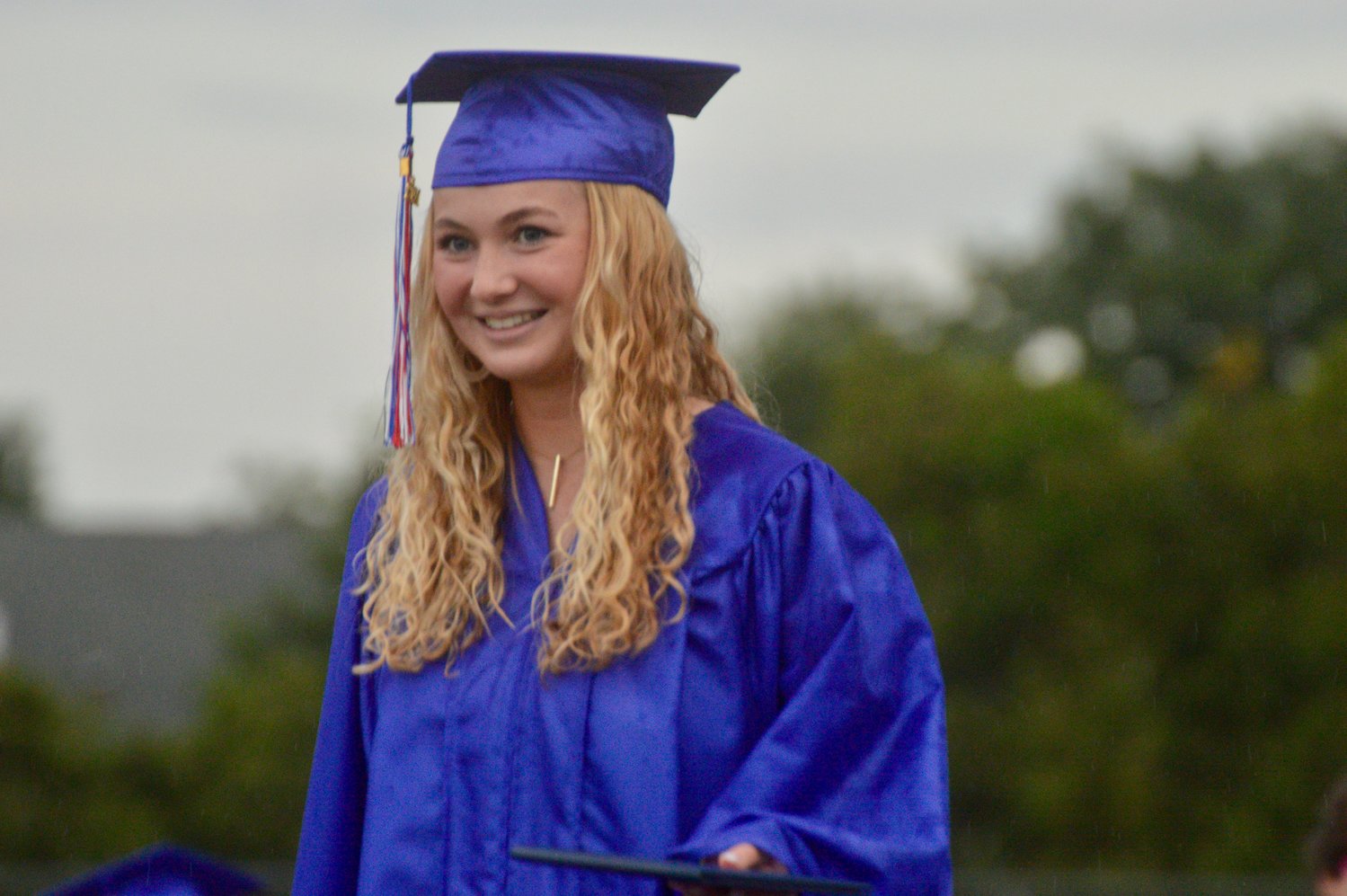 Hailey Pratt walks off the stage after receiving her diploma.