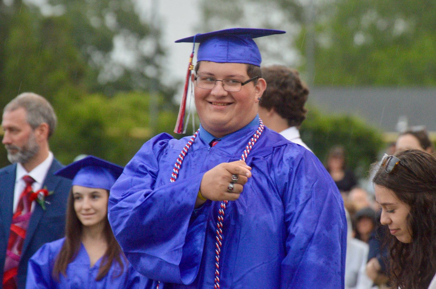 John Weiderman recognizes a friendly face before he collects his diploma.
