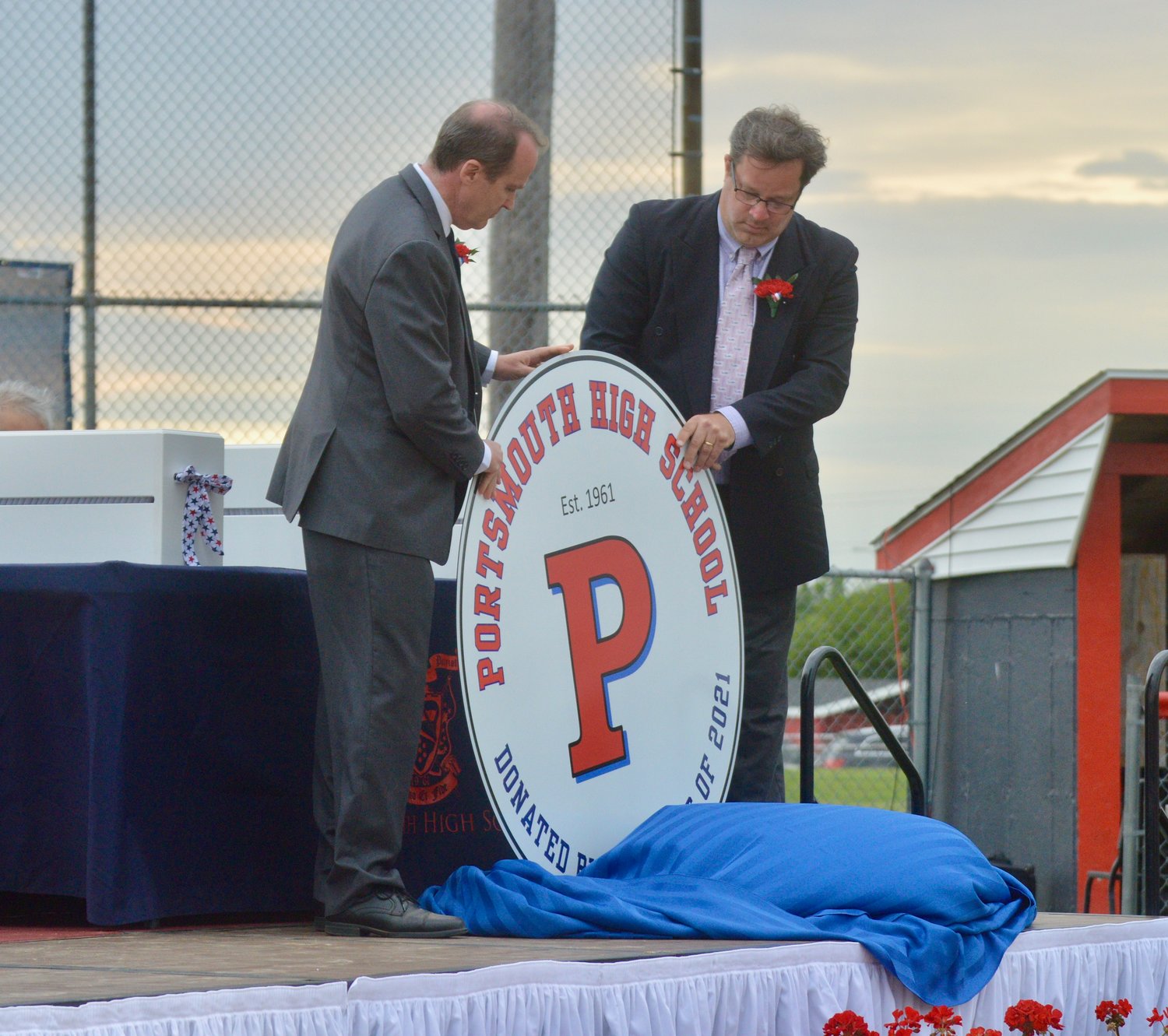 The new Portsmouth High School Patriot Crest, a gift from the Class of 2021, is unveiled.