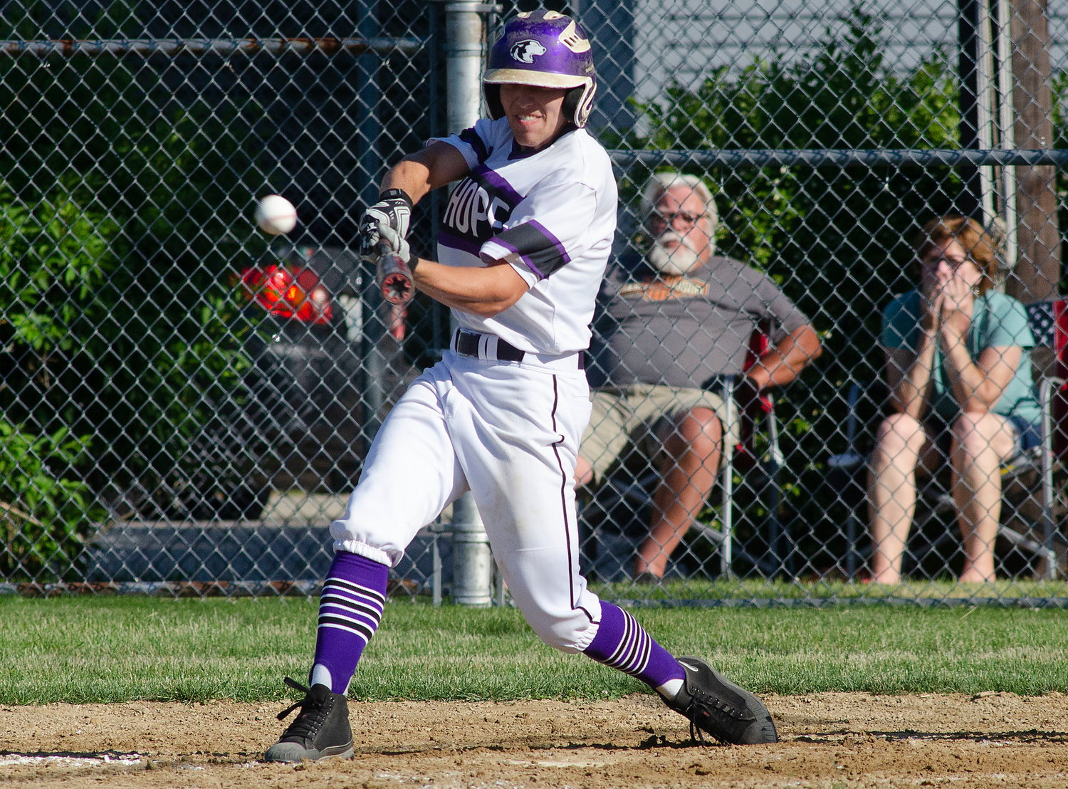 Senior first baseman Matt Brackett smashes a pitch into the right centerfield gap for a two RBI triple during the team's playoff game against Tiverton on Sunday night. Mt. Hope won the contest, 5-4, in extra innings.