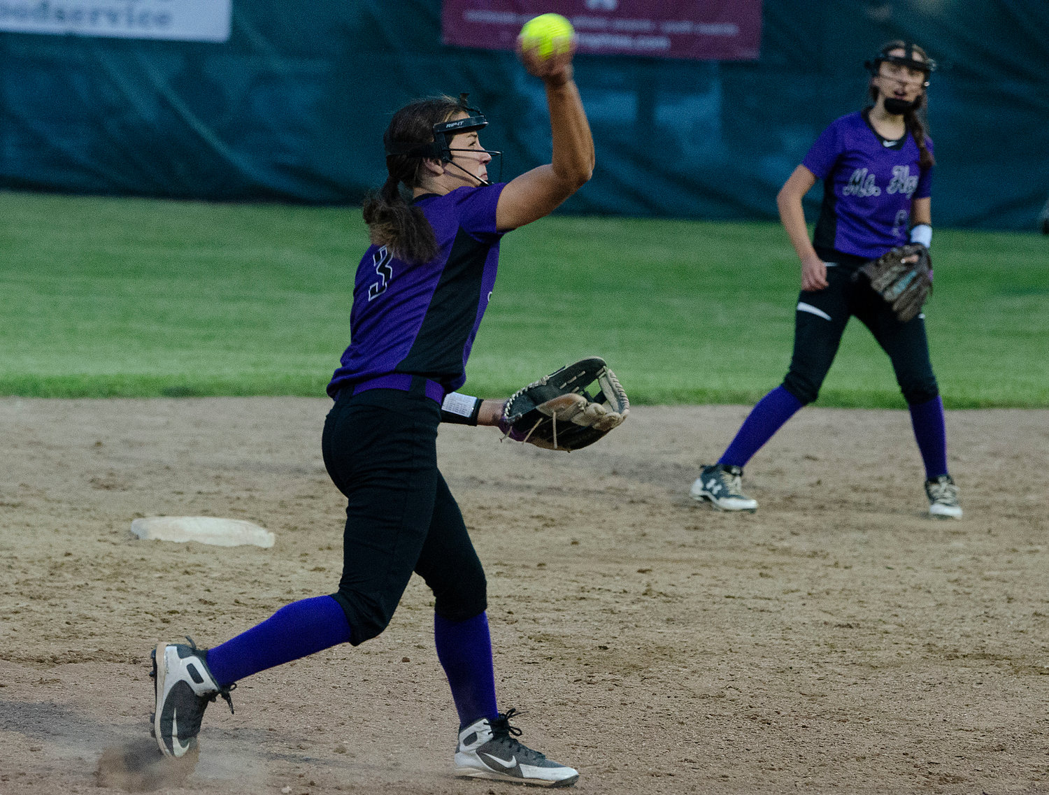 Huskies senior shortstop Izzy Savinon throws the ball to first for an out.
