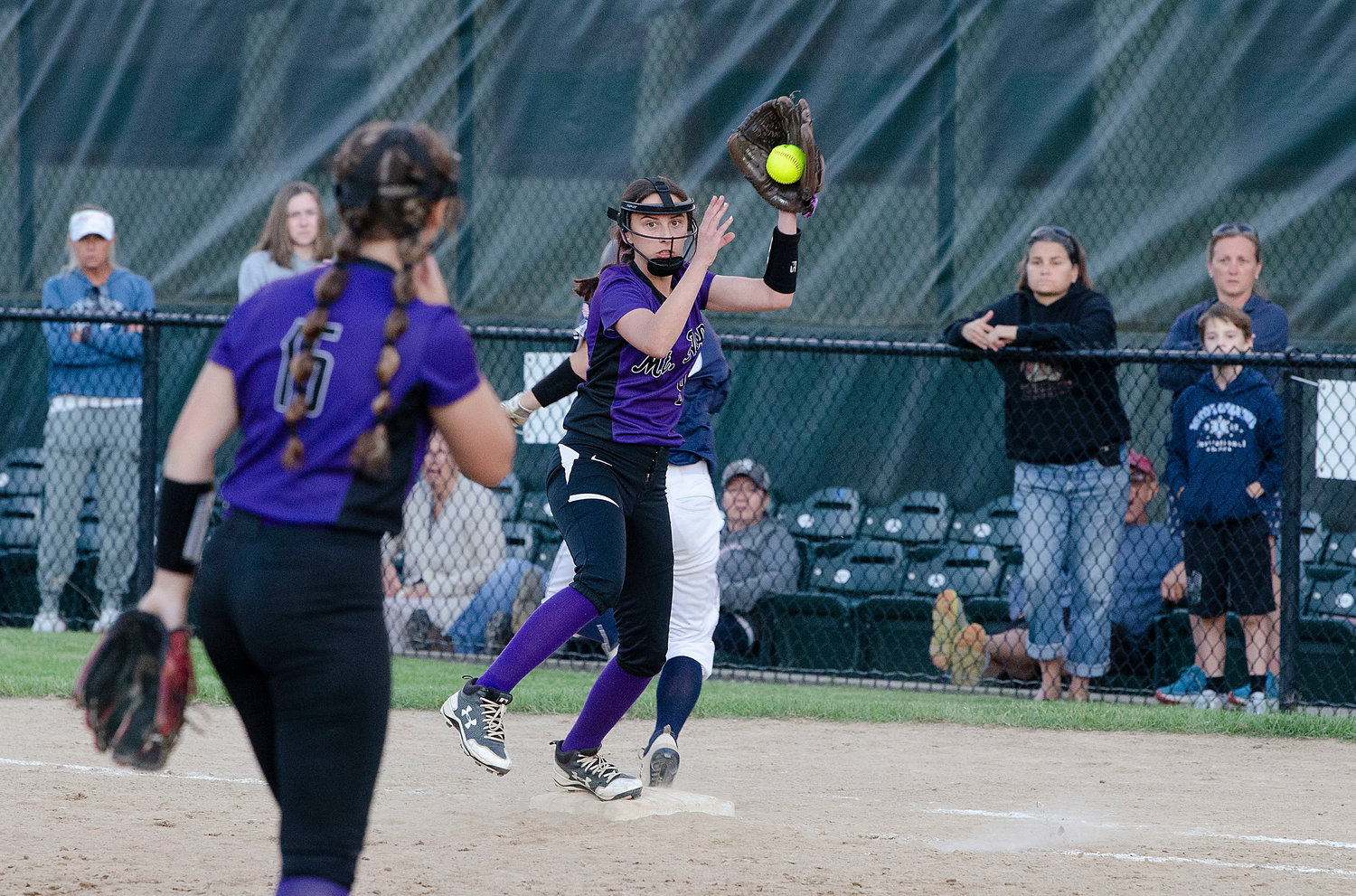 Second baseman Gabby Hollands makes the catch at first base for an out on a Broncos bunt attempt.