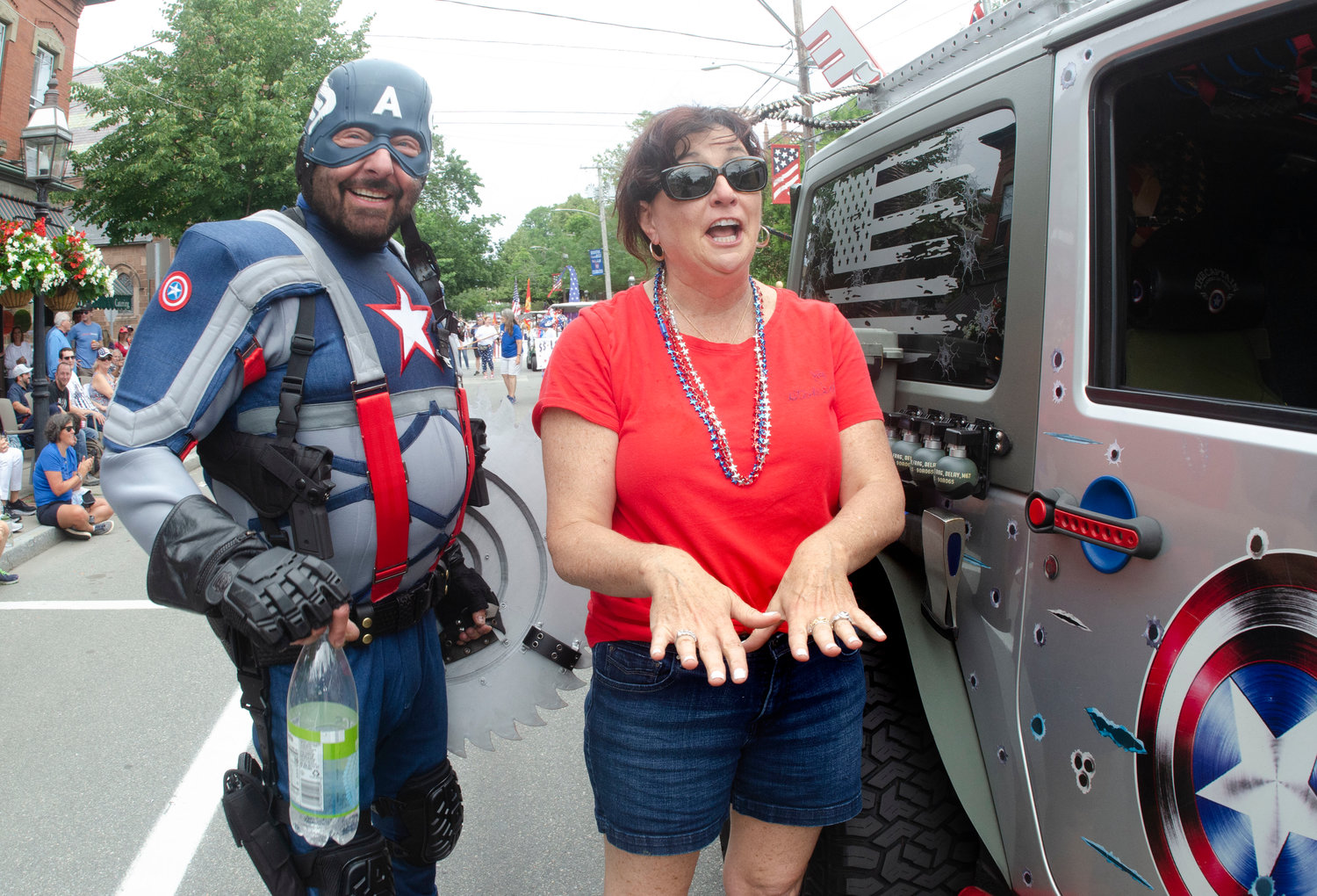 Captain America, Brian Solitro, stopped in downtown Bristol to propose to his girlfriend, Maura Turner. The newlyweds pause for a moment before a cheering crowd after she accepted his proposal.
