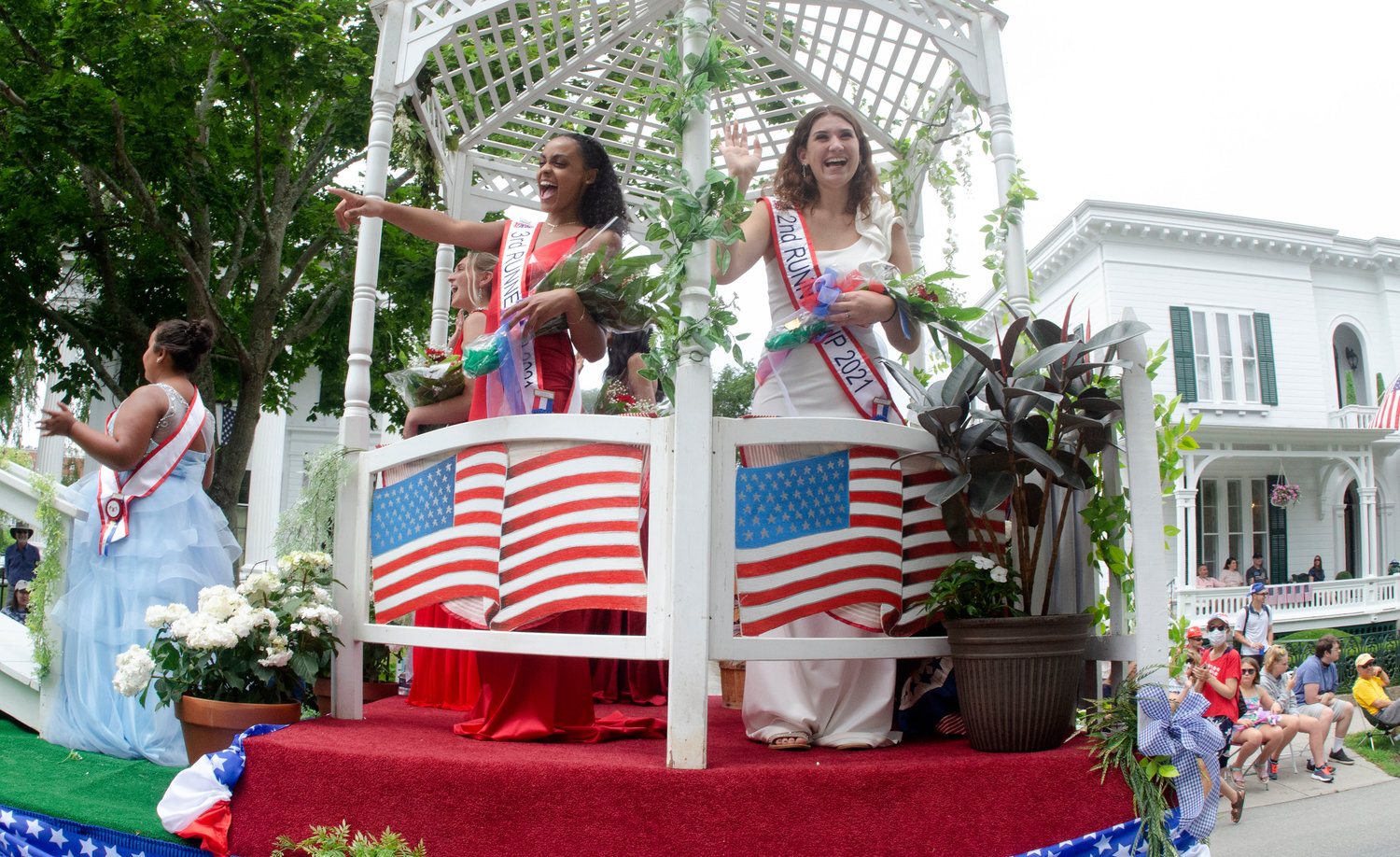 Having a ball atop the Miss Fourth float are Emily Almonte (left) and Samantha Martins.