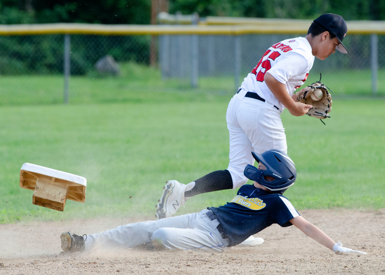 Barrington’s Miles Dolan is out at second during a play in the first game of the District 2 finals. Barrington went on to win the game, 2-0, and force a second, deciding game.