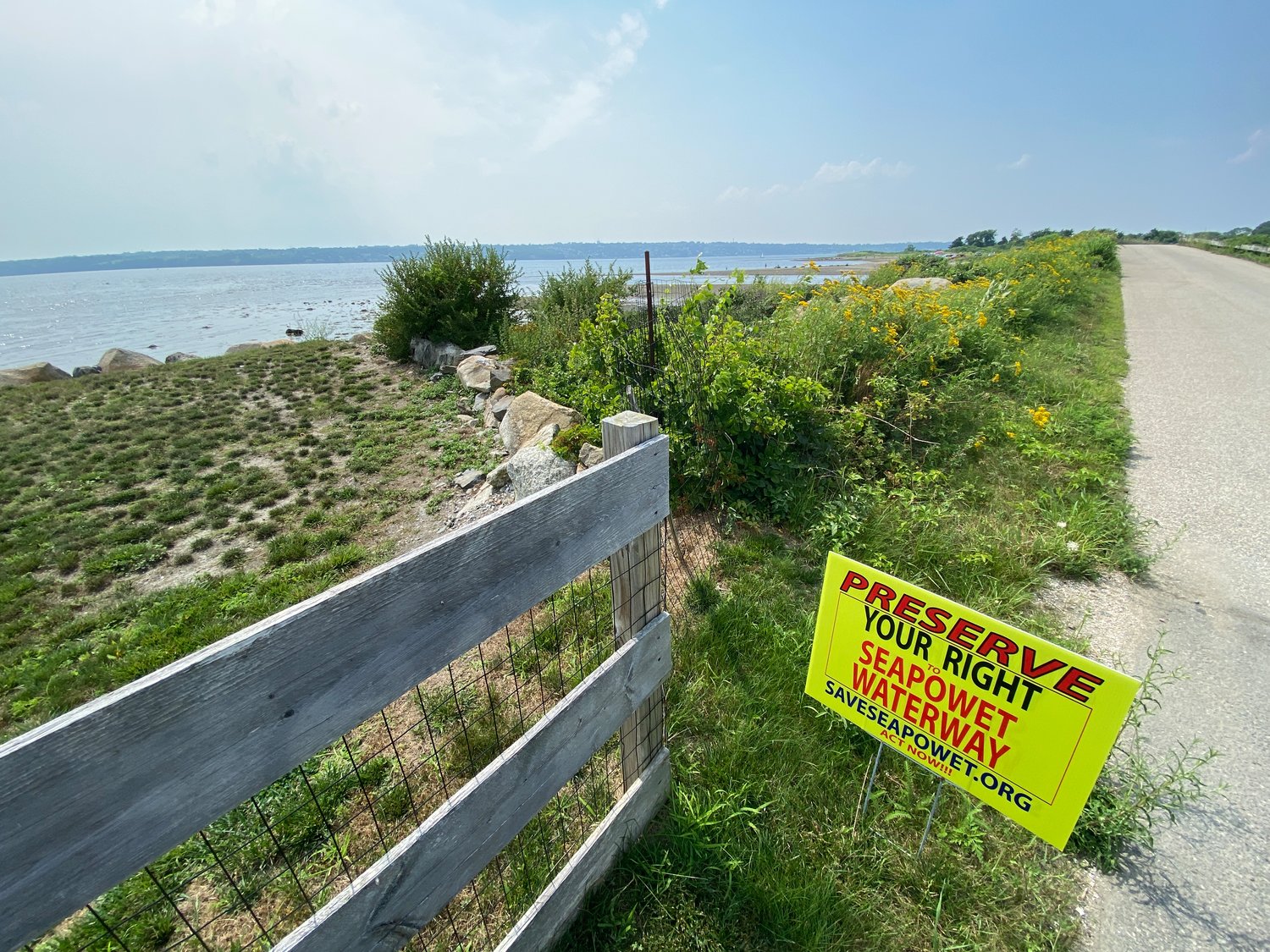 Seapowet area residents opposed to two oyster farms off their shores have mobilized in recent weeks, planting hundreds of signs, launching a website and raising more than $12,000 to cover legal fees.