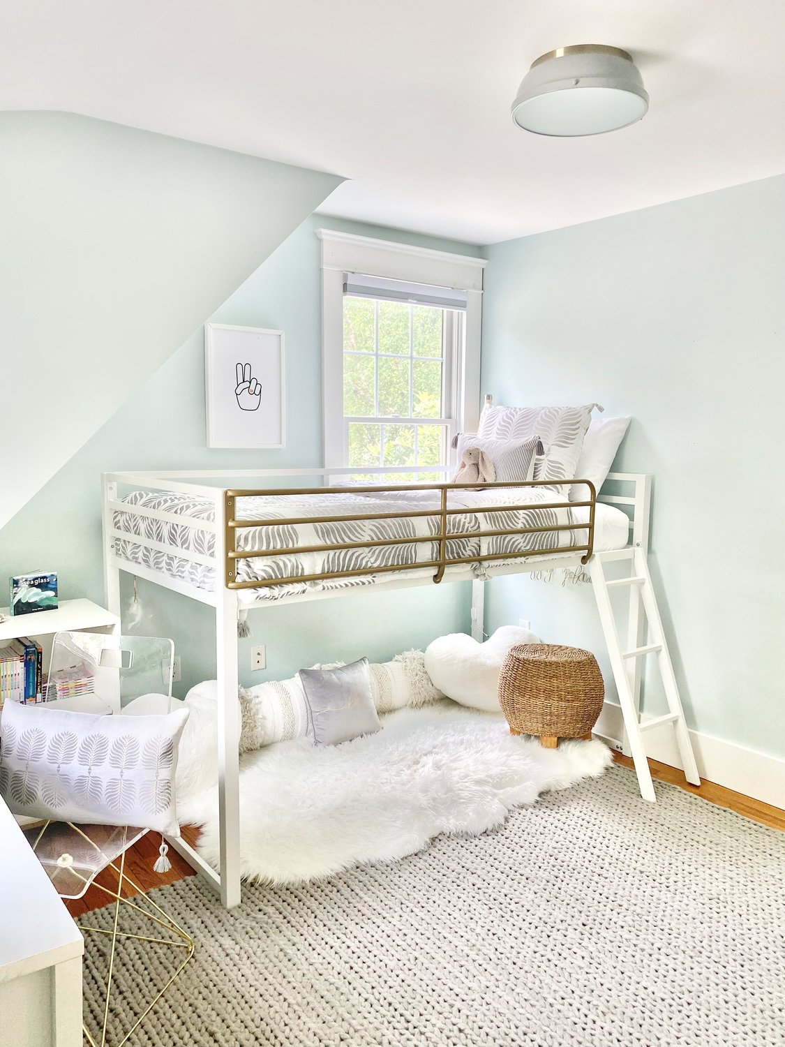 In smaller spaces, utilize a loft bed to create a cozy escape.