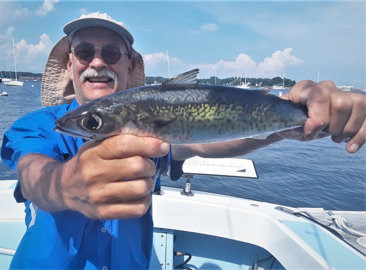 Kevin Fetzer with a chub mackerel he caught off Beavertail Light, Jamestown last year. These speedsters are fun to catch and eat, and this year they are larger, in the 20 inch range.