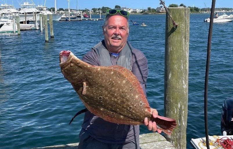 Flukezilla: Tom Torrico of Massachusetts with the 14 pound, 29 inch fluke (summer flounder) he caught fishing off Block Island last week.