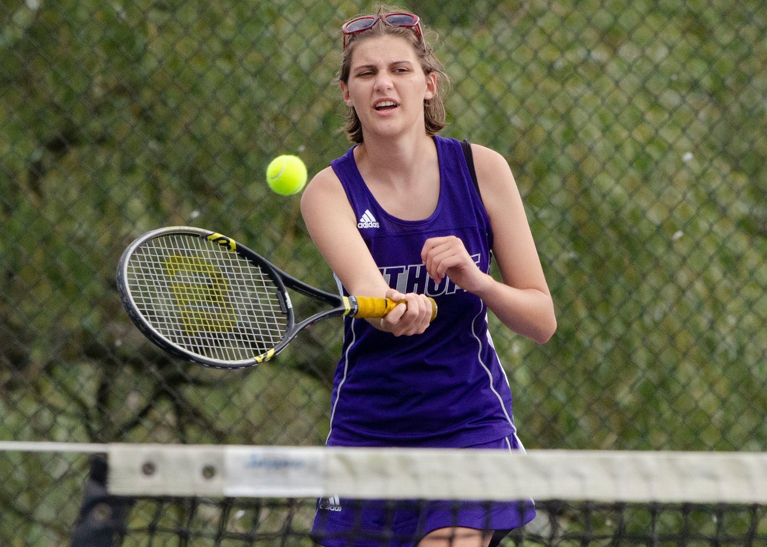 Emily Marino hits a cross court forehand during the first doubles "We're a fairly young team of go-getters,” against South Kingstown.