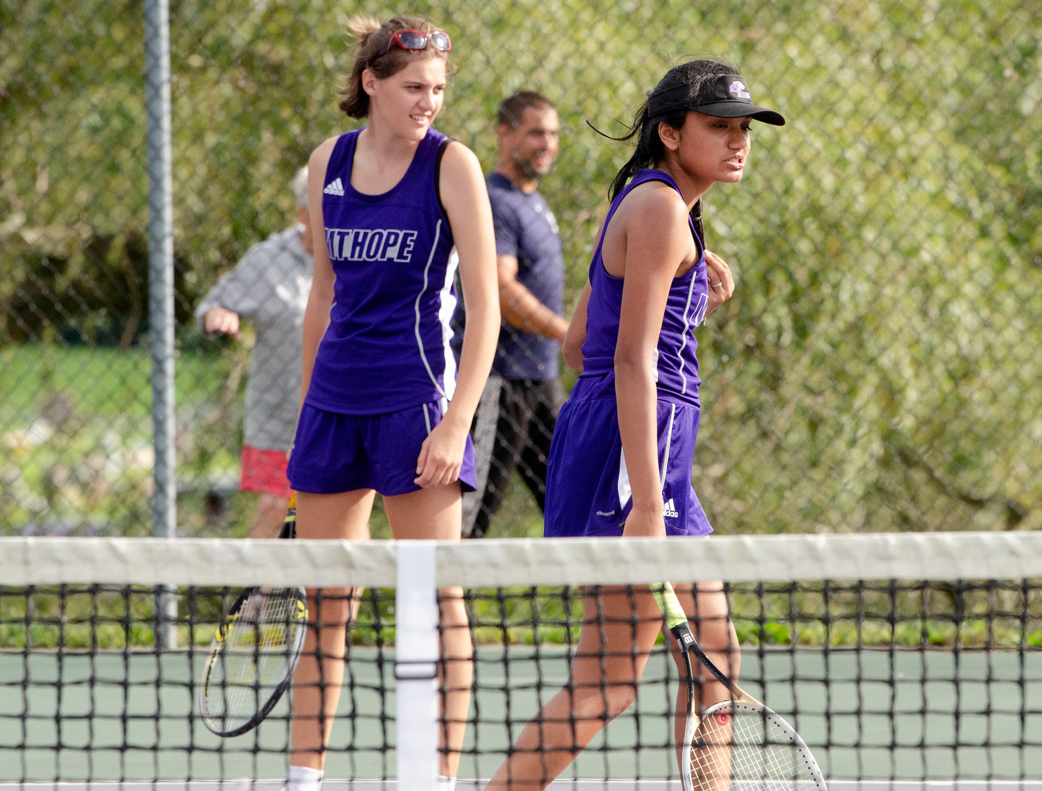 First doubles teammates, Emily Marino and Aditi Mehta set up to play their match against South Kingstown.