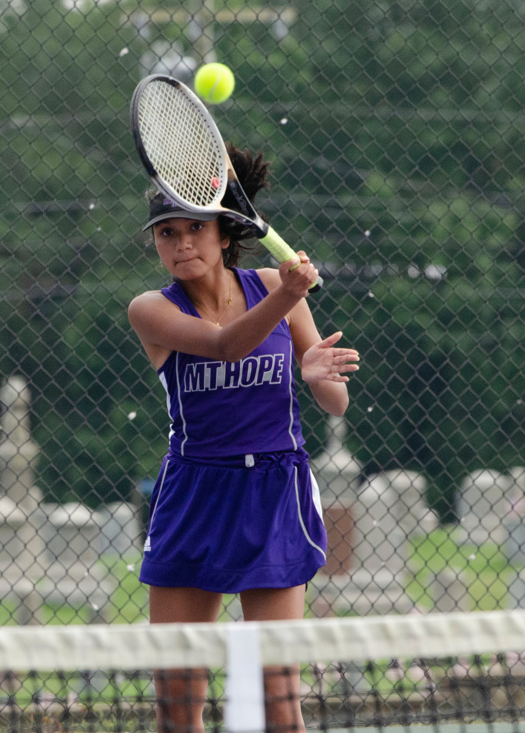 First doubles player Aditi Metha hits a forehand during their match against South Kingstown.