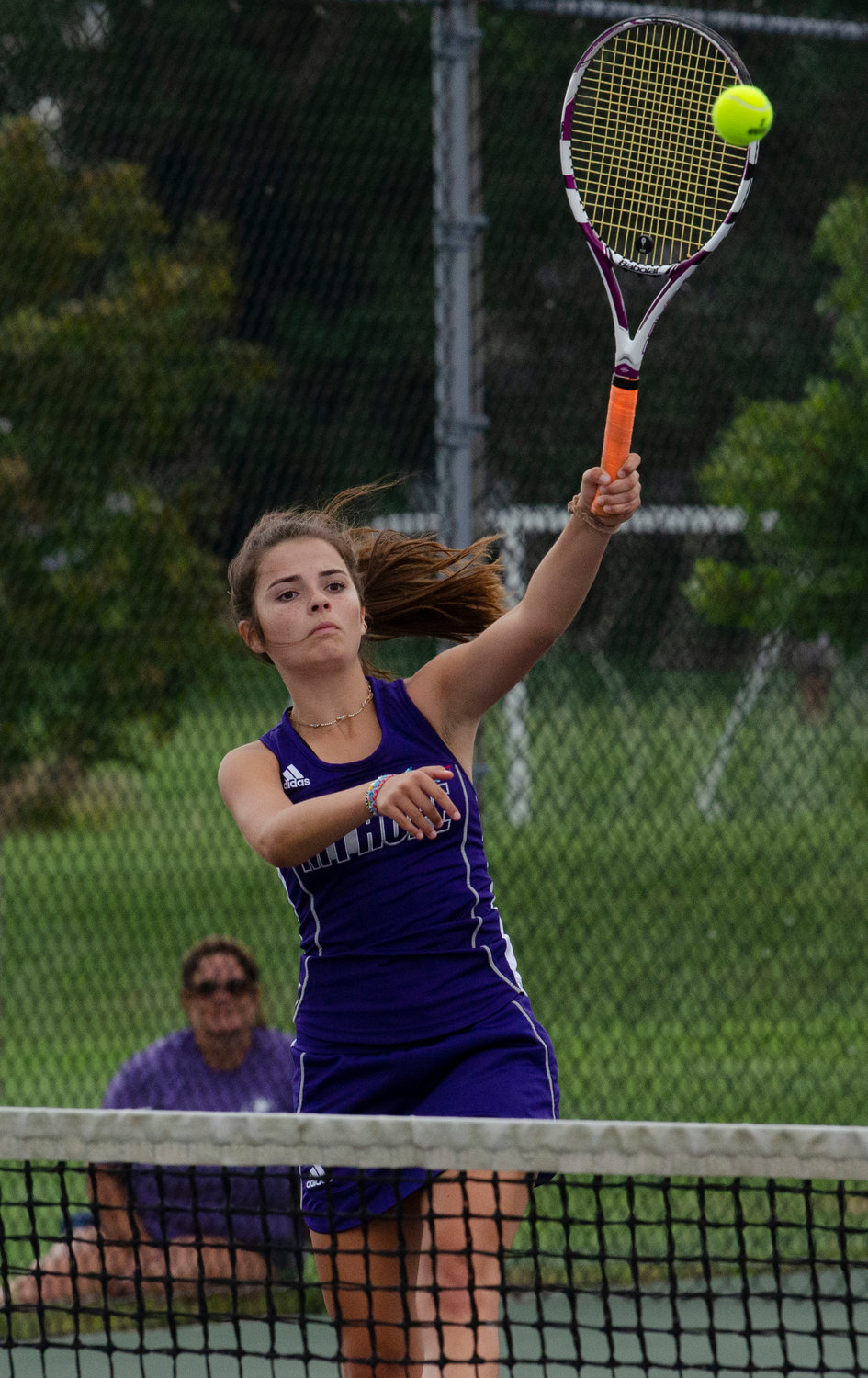 Zelda Hayes hits an overhand slam during the second doubles match against South Kingstown on Wednesday.