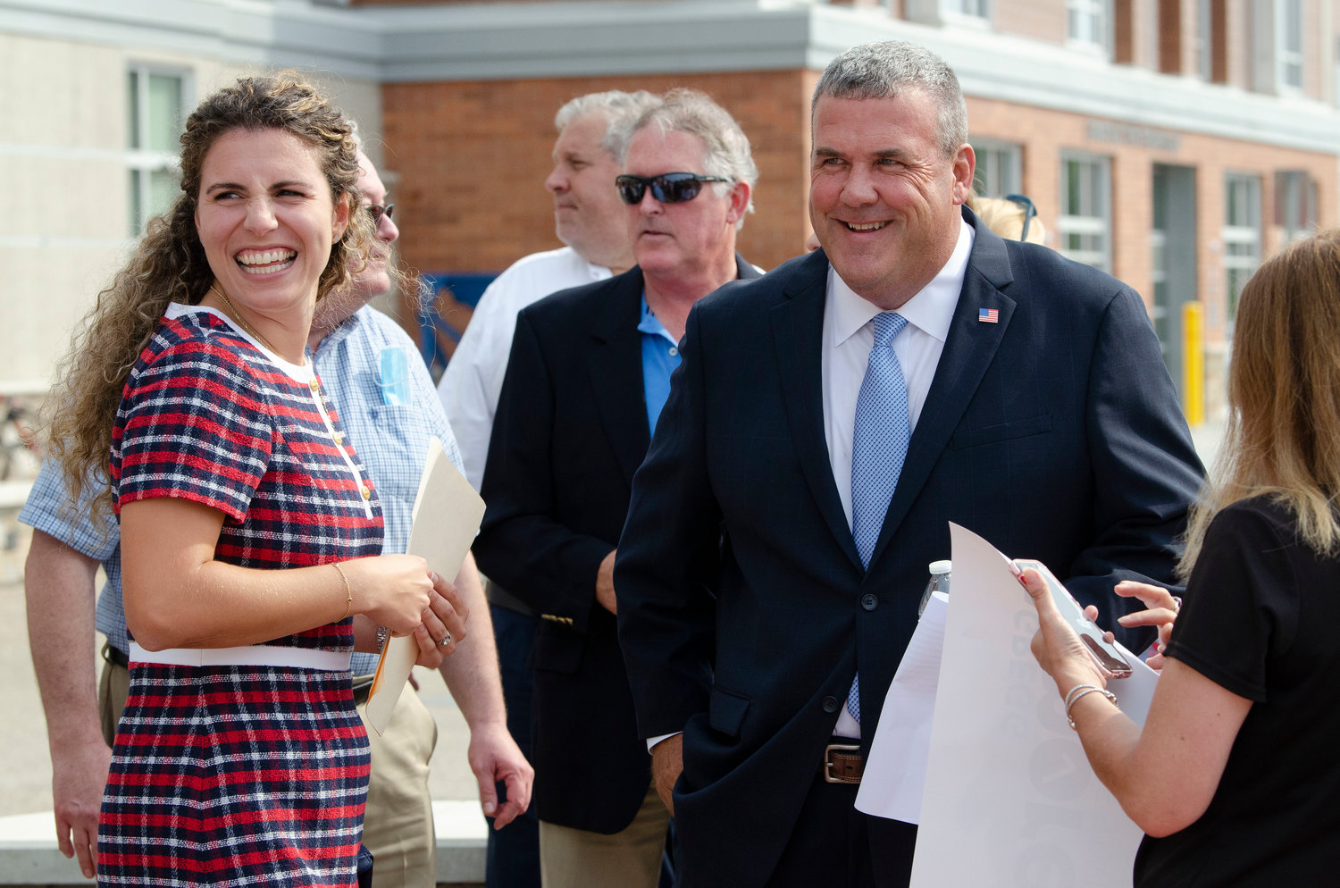 State Representative Katherine Kazarian (D-District 63) (left) and Representative Gregg Amore converse with friends and colleagues before Mr. Amore announced his candidacy to be the Democratic nominee for Rhode Island's next Secretary of State during a press conference Wednesday afternoon, Sept. 15, held at his career-long place of employ,  East Providence High School.