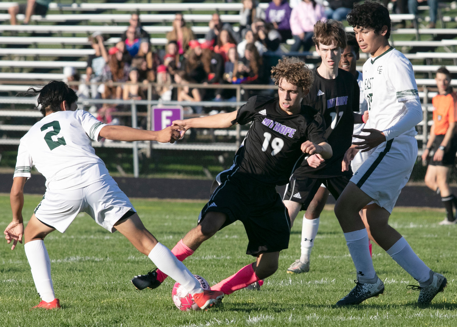 Winger Maddox Canario vies for the ball in the East box, with Dylan Brol looking on.