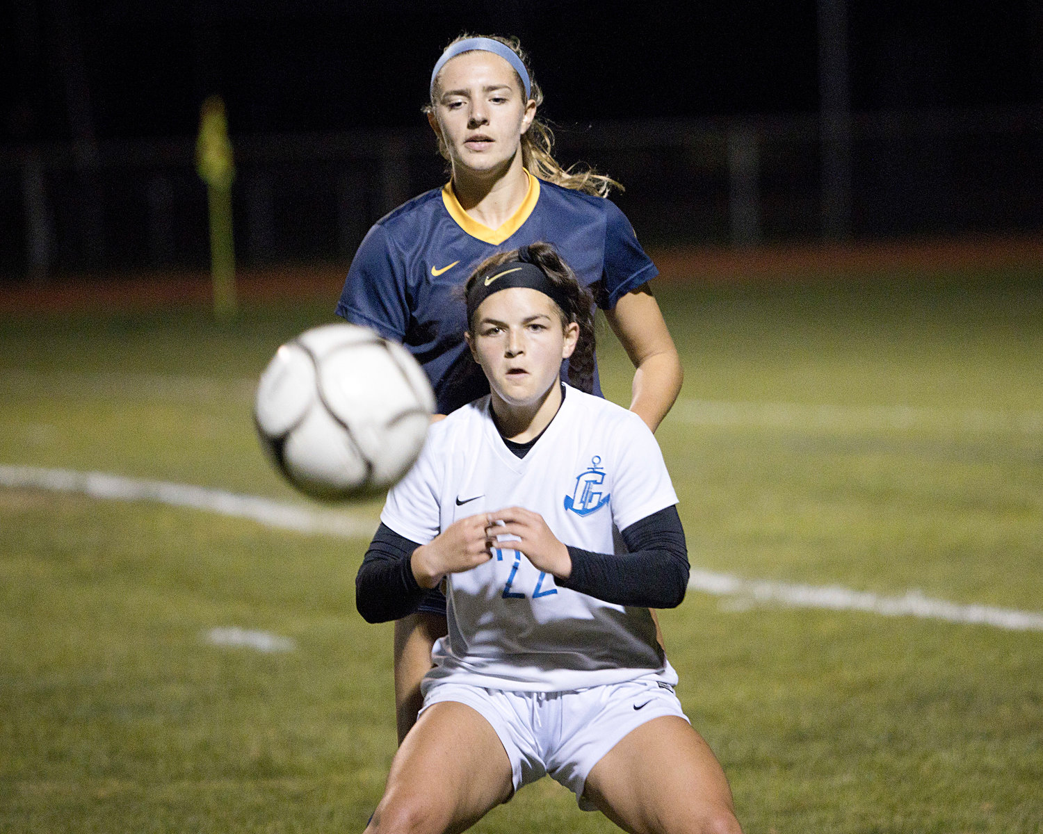Mady Calhoun pressures a Cumberland opponent on a throw-in pass.