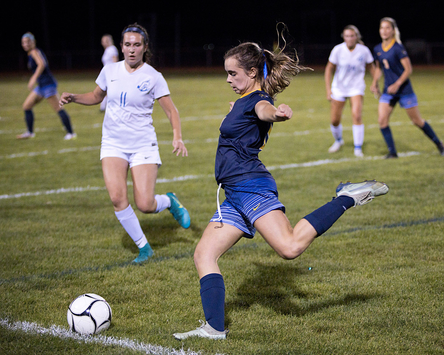 Ella Abadi fires a pass upfield while competing against Cumberland, Friday night.
