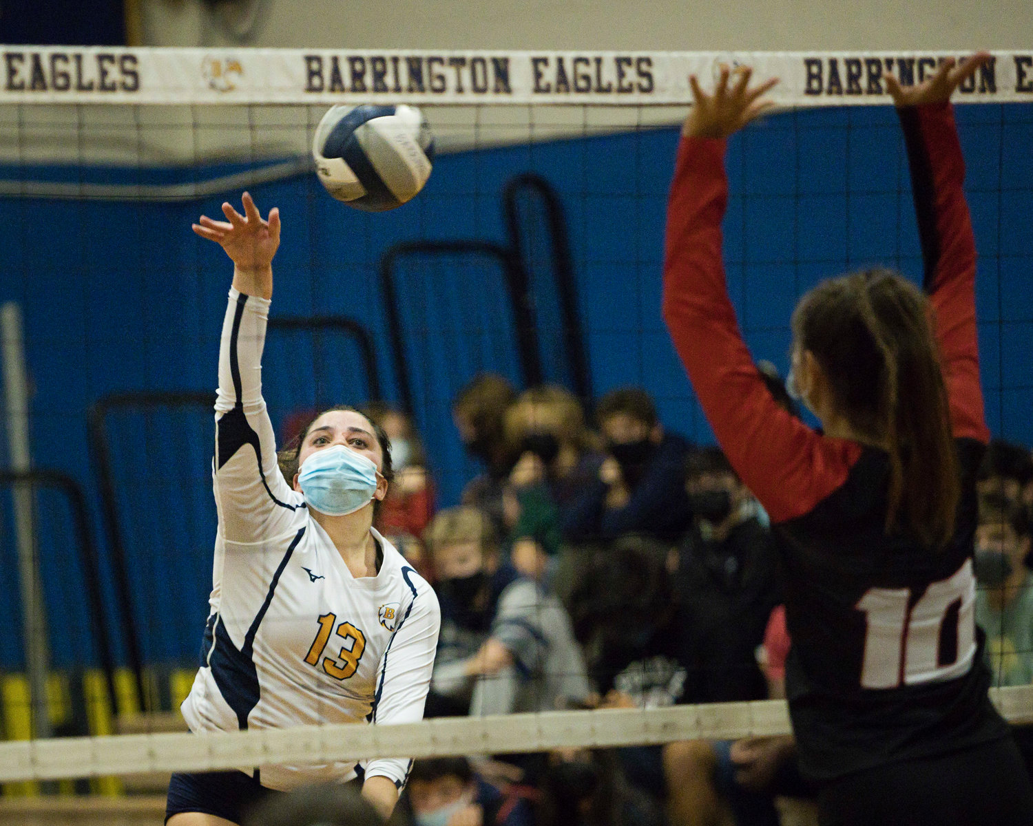 Ally Pfeffer sends the ball back toward the Rogers side of the net.