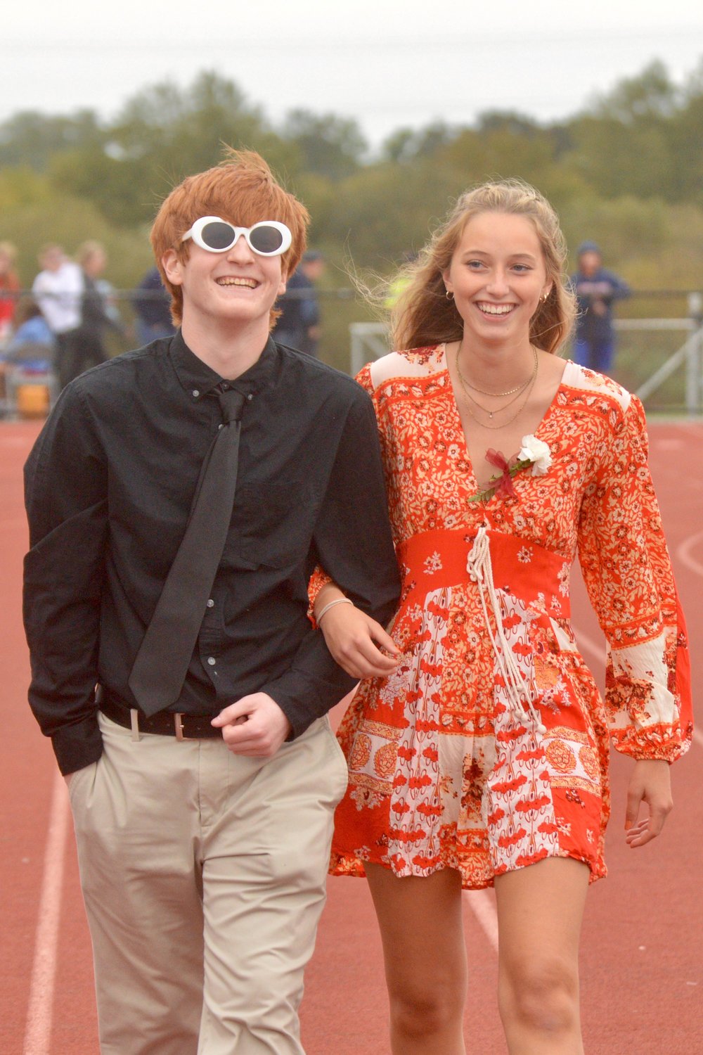 Joe Cawley and Grace Van Patten, Homecoming king and queen, are introduced at halftime of the Portsmouth High football game against East Greenwich.